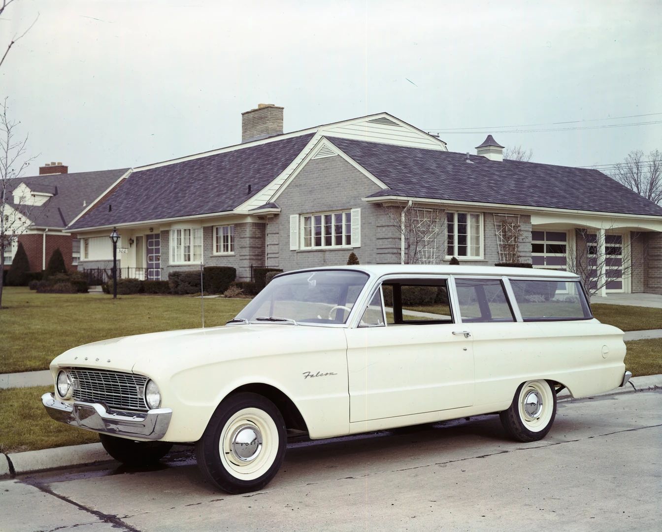 Vintage Ad: The Peanuts Gang Guest-Stars In The World's Wordiest Ford Falcon Ad 12 Press photo of a white 1960 Ford Falcon two-door station parked in front of a house