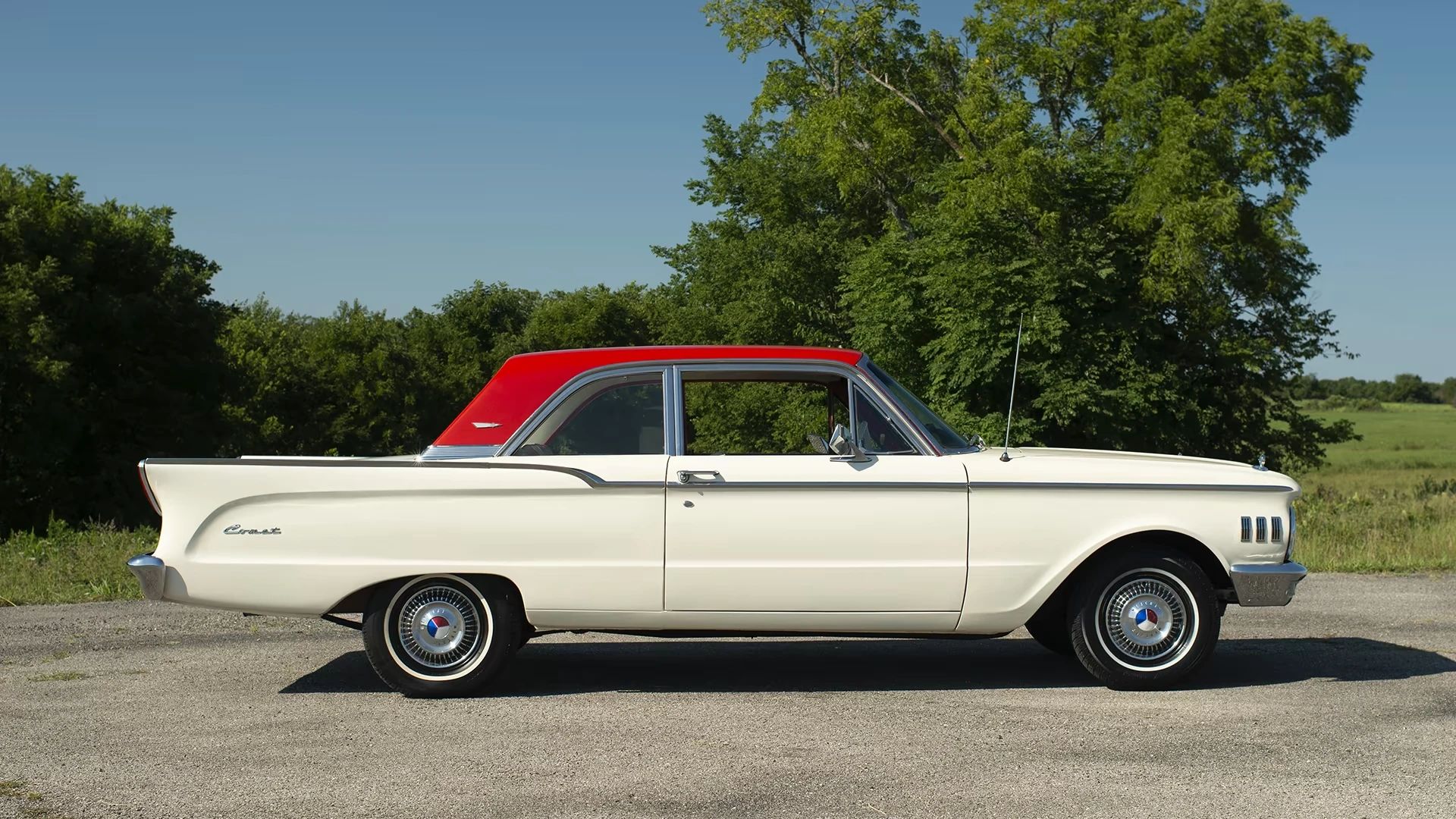 Right side view of a white 1961 Comet two-door sedan with a red roof