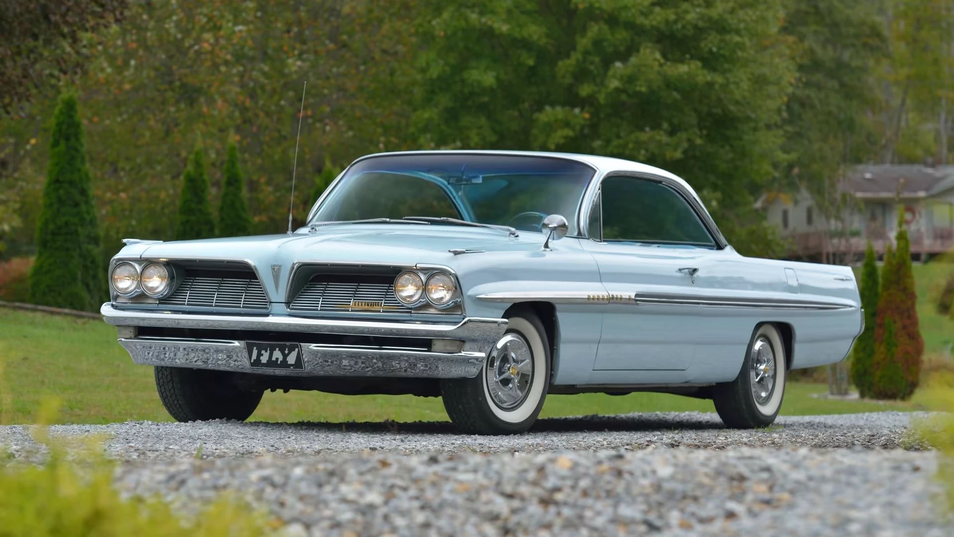 Left front 3q view of a light blue 1961 Pontiac Bonneville two-door "bubbletop" hardtop