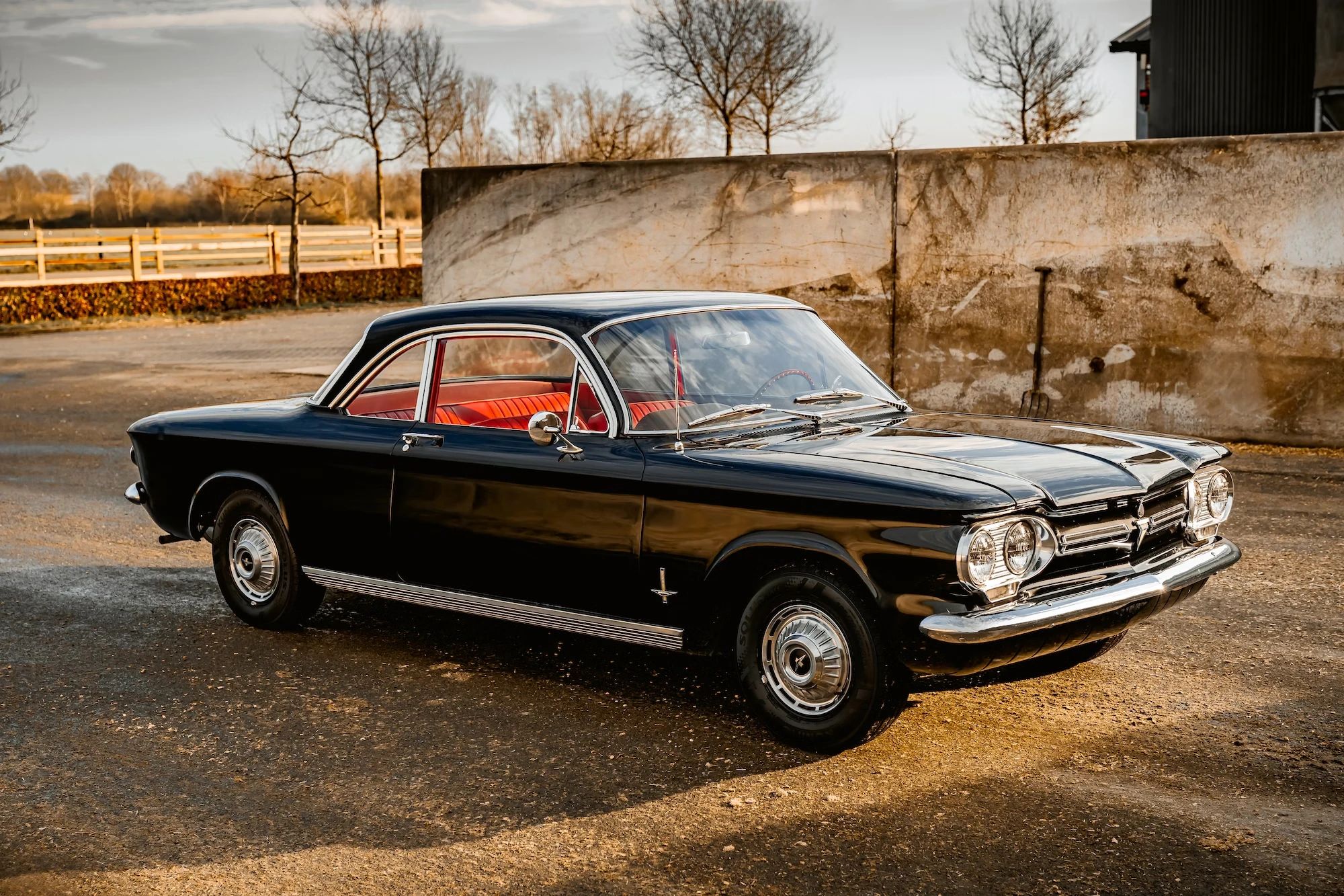 Right front 3q view of a black 1962 Chevrolet Corvair coupe