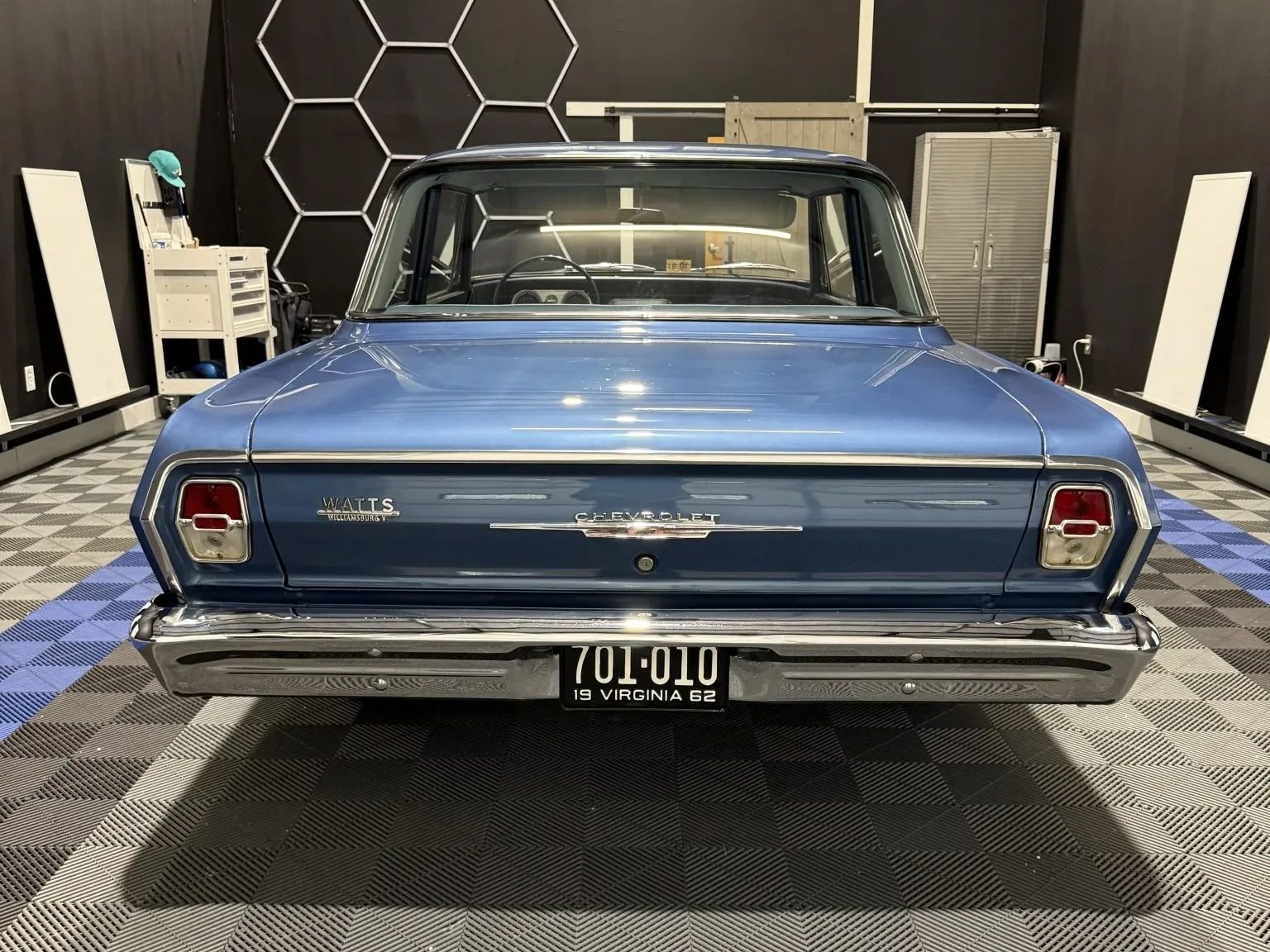 Rear view of a blue 1962 Chevrolet Chevy II sedan