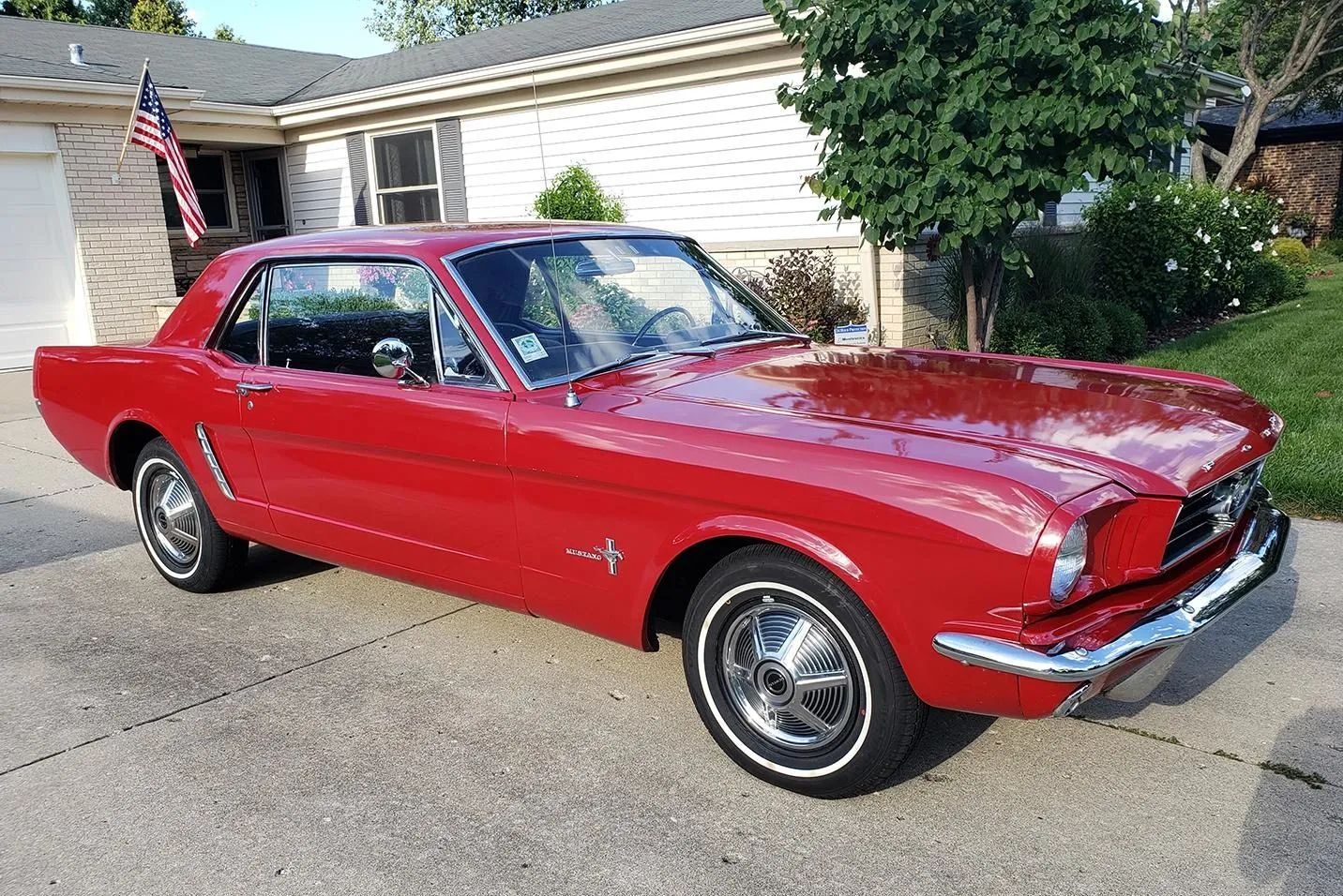 Right front 3q view of a red 1965 Ford Mustang hardtop