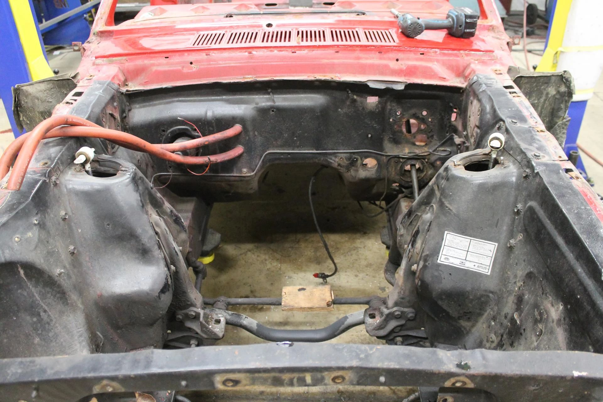 CC Tech: How the Mustang, Cougar, And Maverick Differed From The Original Ford Falcon Platform 15 Photo of the empty engine bay of a red 1965 Ford Mustang convertible