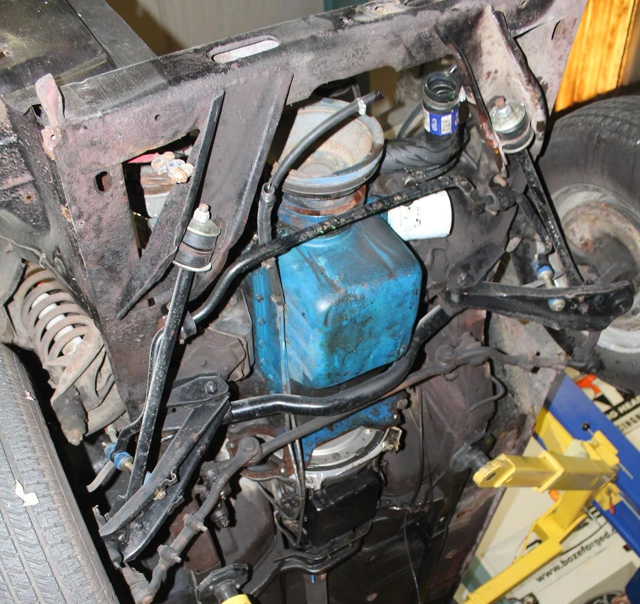 CC Tech: How the Mustang, Cougar, And Maverick Differed From The Original Ford Falcon Platform 17 Underside of the front suspension of a 1965 Ford Mustang, showing the diagonal braces and drag strut mounts