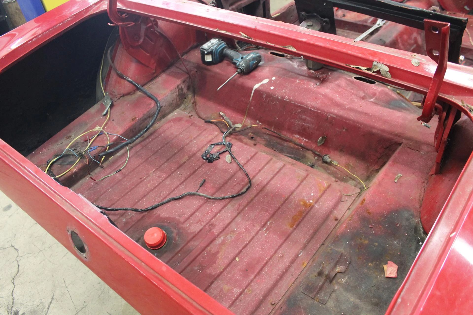 CC Tech: How the Mustang, Cougar, And Maverick Differed From The Original Ford Falcon Platform 18 Fuel tank under the trunk of a 1965 Ford Mustang