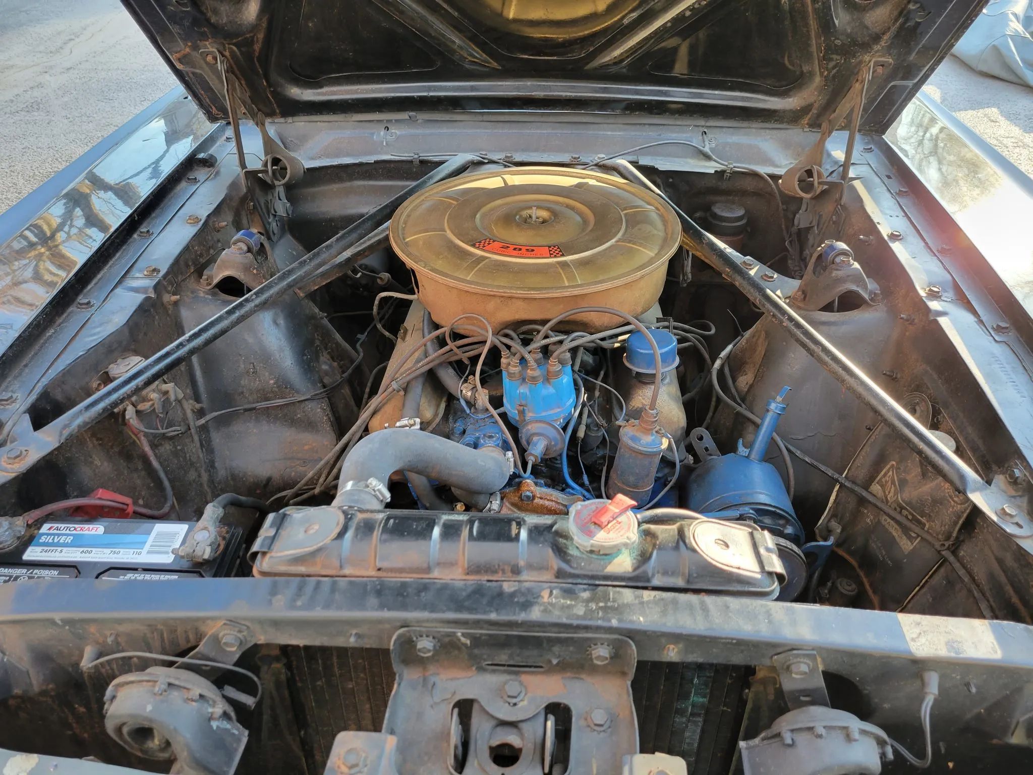 CC Tech: How the Mustang, Cougar, And Maverick Differed From The Original Ford Falcon Platform 12 Engine bay of a black 1965 Ford Mustang convertible