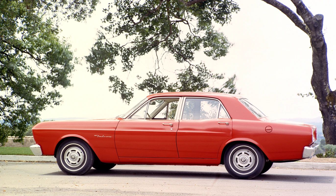 CC Tech: Ford Falcon, Comet, and Fairlane – How These Unit-Body Fords Were Alike (And Different) 49 Press photo showing the left side of a Candyapple Red 1966 Ford Falcon four-door sedan