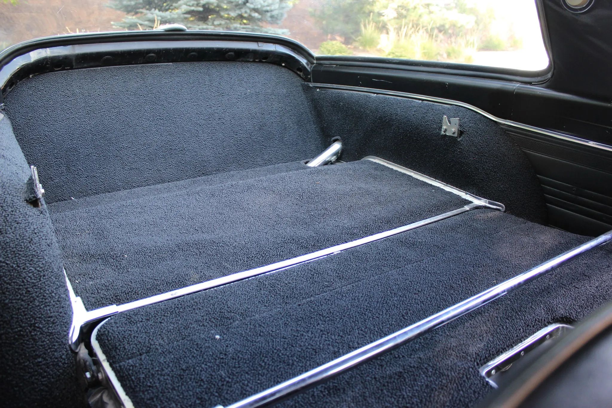 Cargo area of a 1966 Plymouth Barracuda with the rear seat folded down