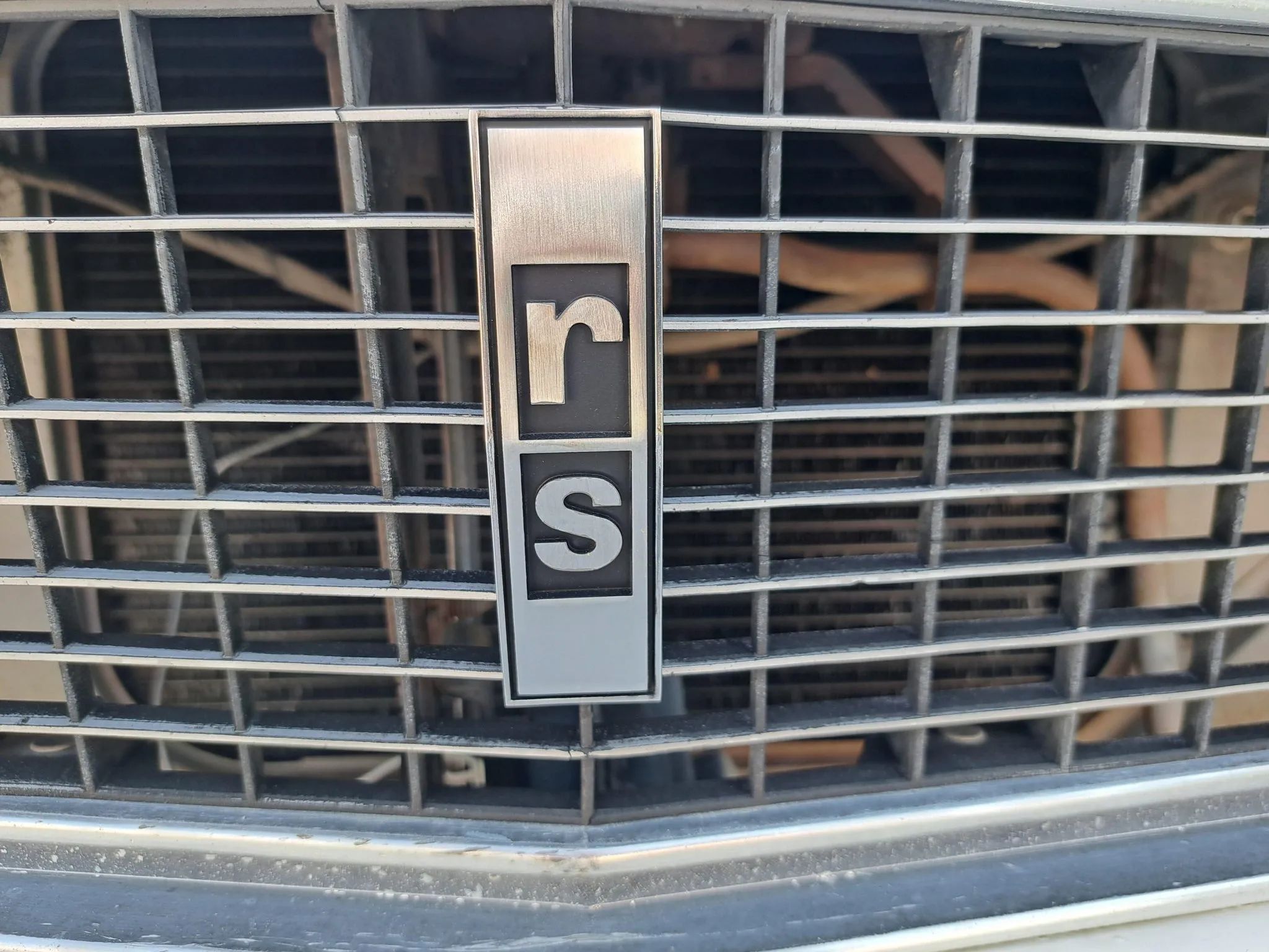 1967 Camaro Rally Sport With 250 Six And 3-Speed Manual: It Was Quicker Than A Lot Of V8s And Handled Better Too 9 "rs" badge on the grille of a 1967 Chevrolet Camaro
