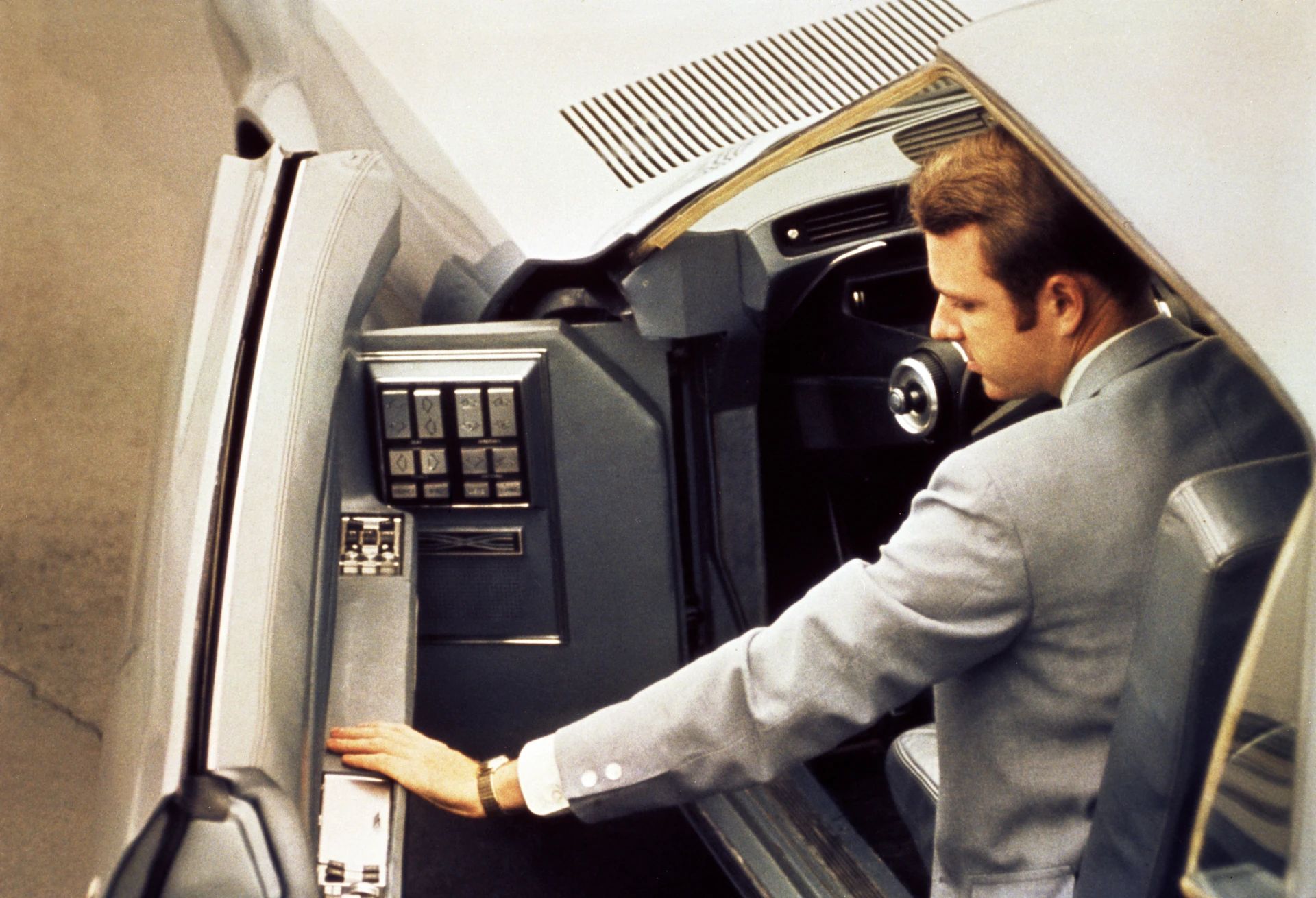 1968 Ford Techna Concept Car: Retro-Future Anachronism With A Weird Offset Driveshaft And Power Doors 14 Color photo of a man in a suit opening the driver's side door of the Ford Techna concept car