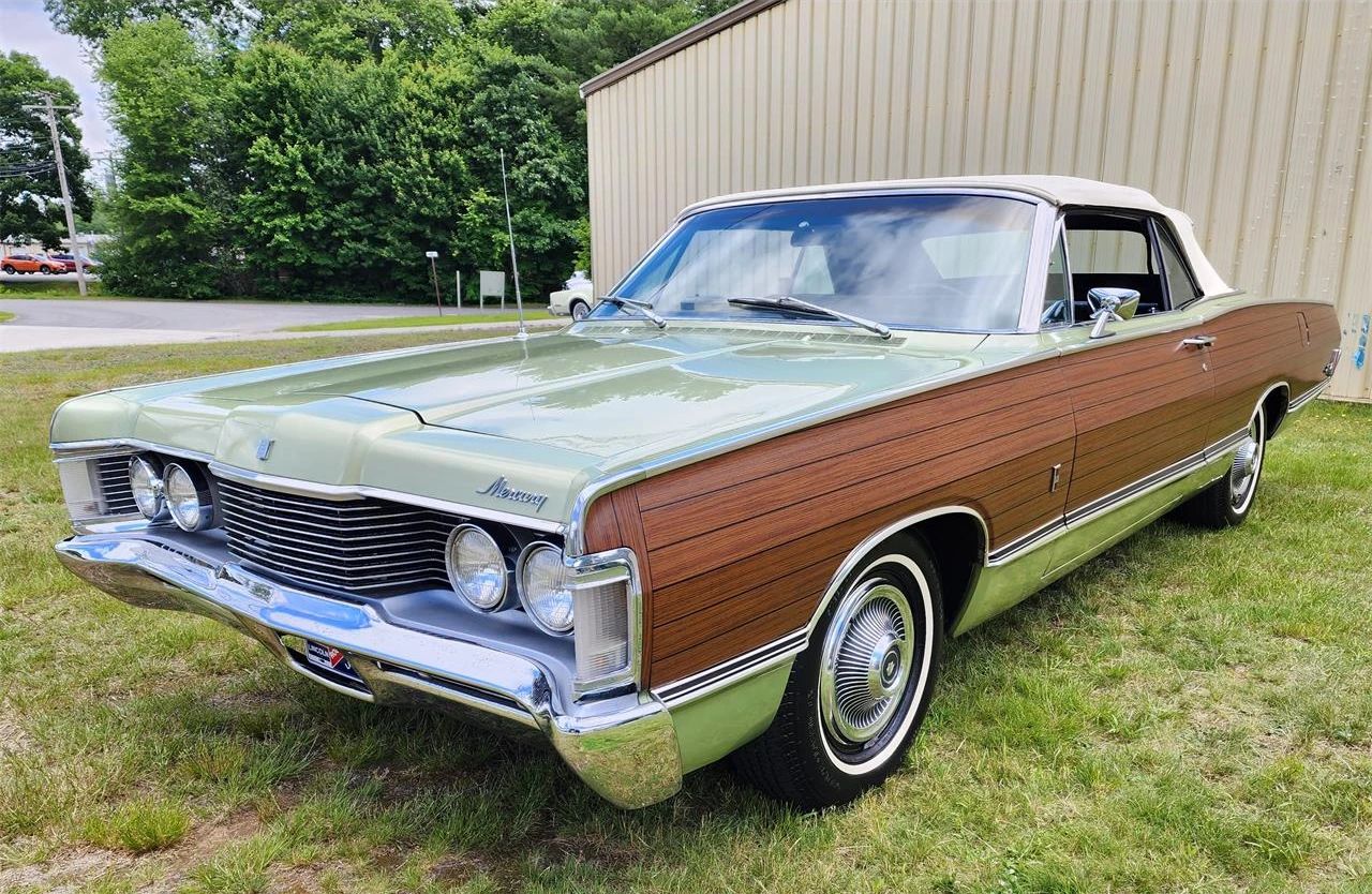 Left front 3q view of a metallic green 1968 Mercury Park Lane convertible with simulated woodgrain side trim