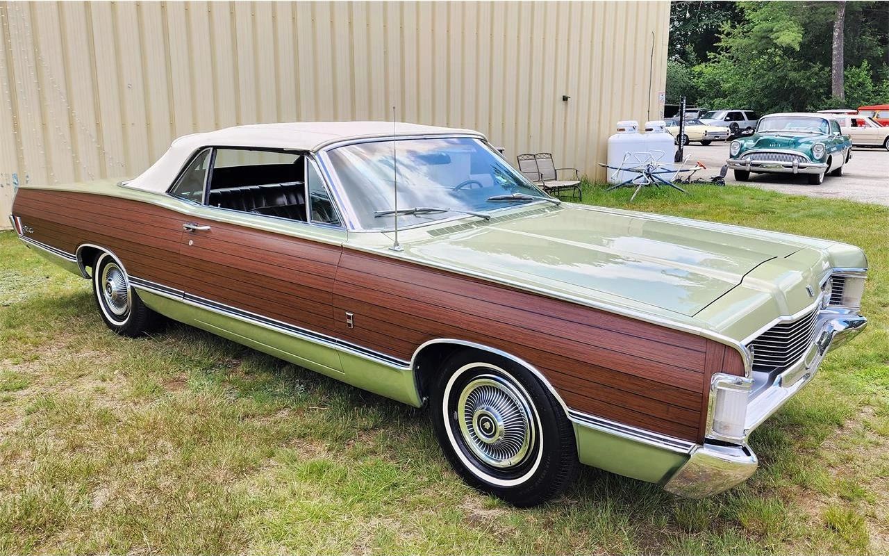 Right side view of a Lime Frost 1968 Mercury Park Lane convertible with simulated wood side trim