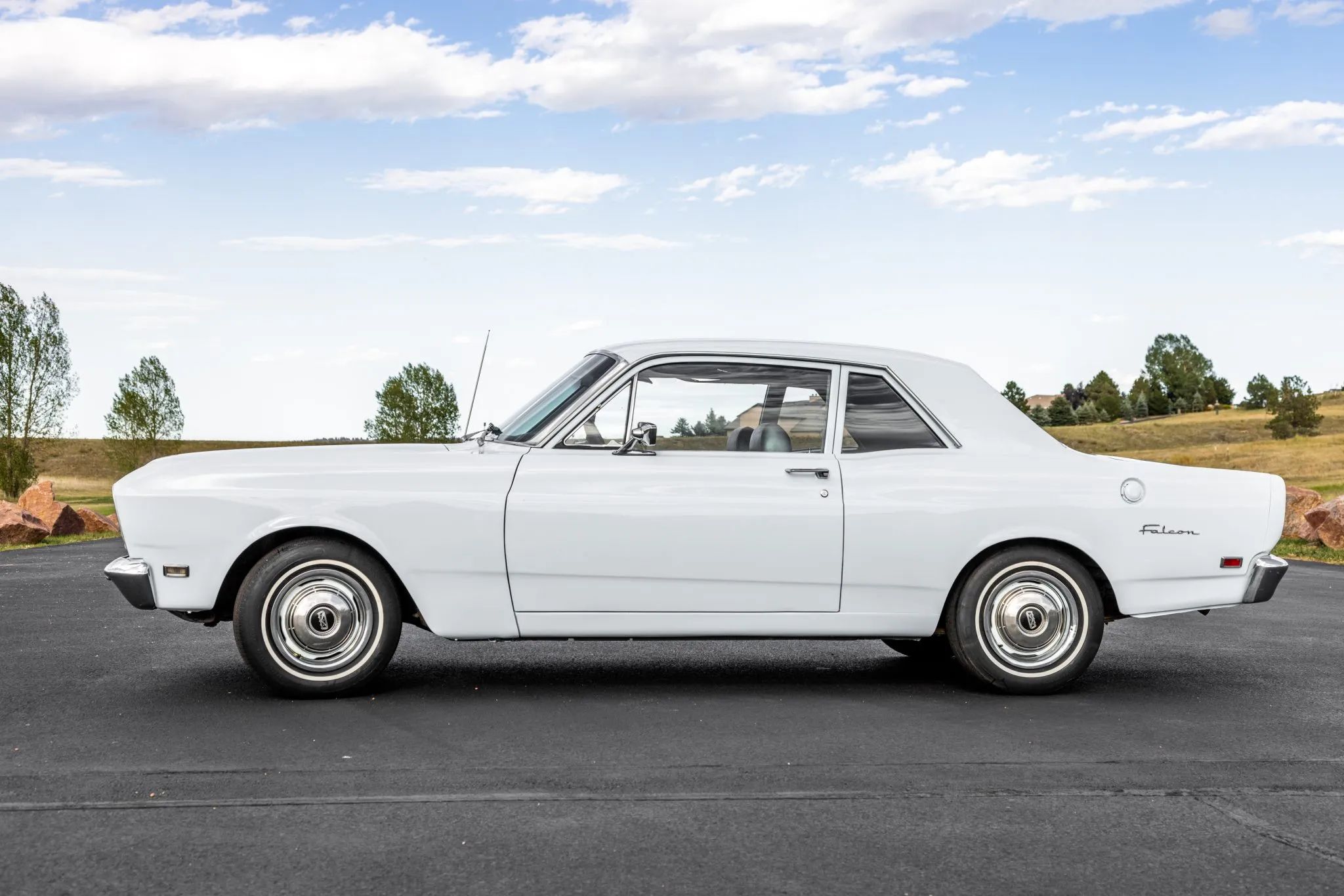 Left side view of a white 1970 Ford Falcon club coupe