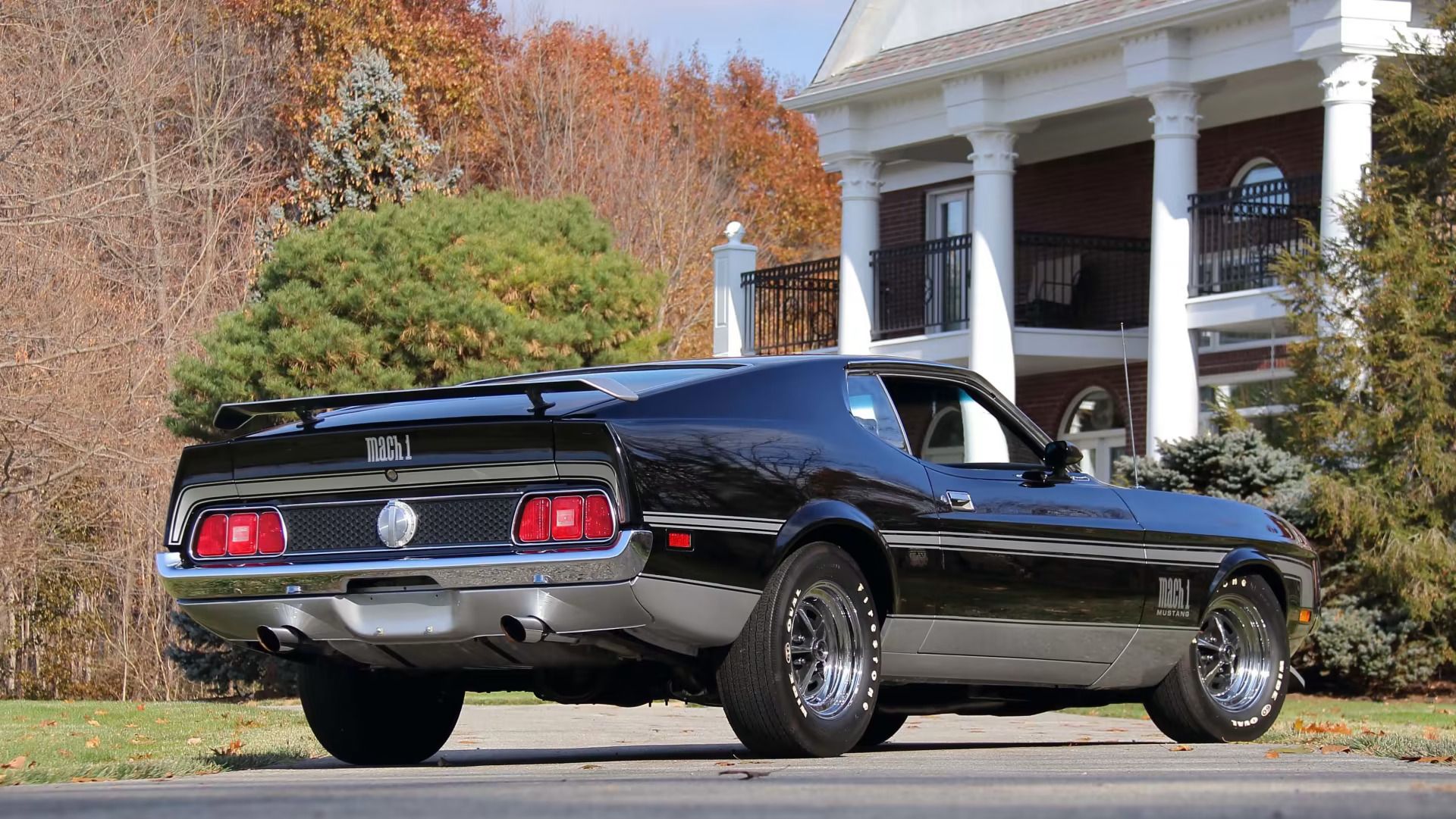 1971 Ford Mustangs: Every Color From Raven Black To Light Gold 4 Picture of Raven Black 1971 Mustang Mach 1 in front of a house