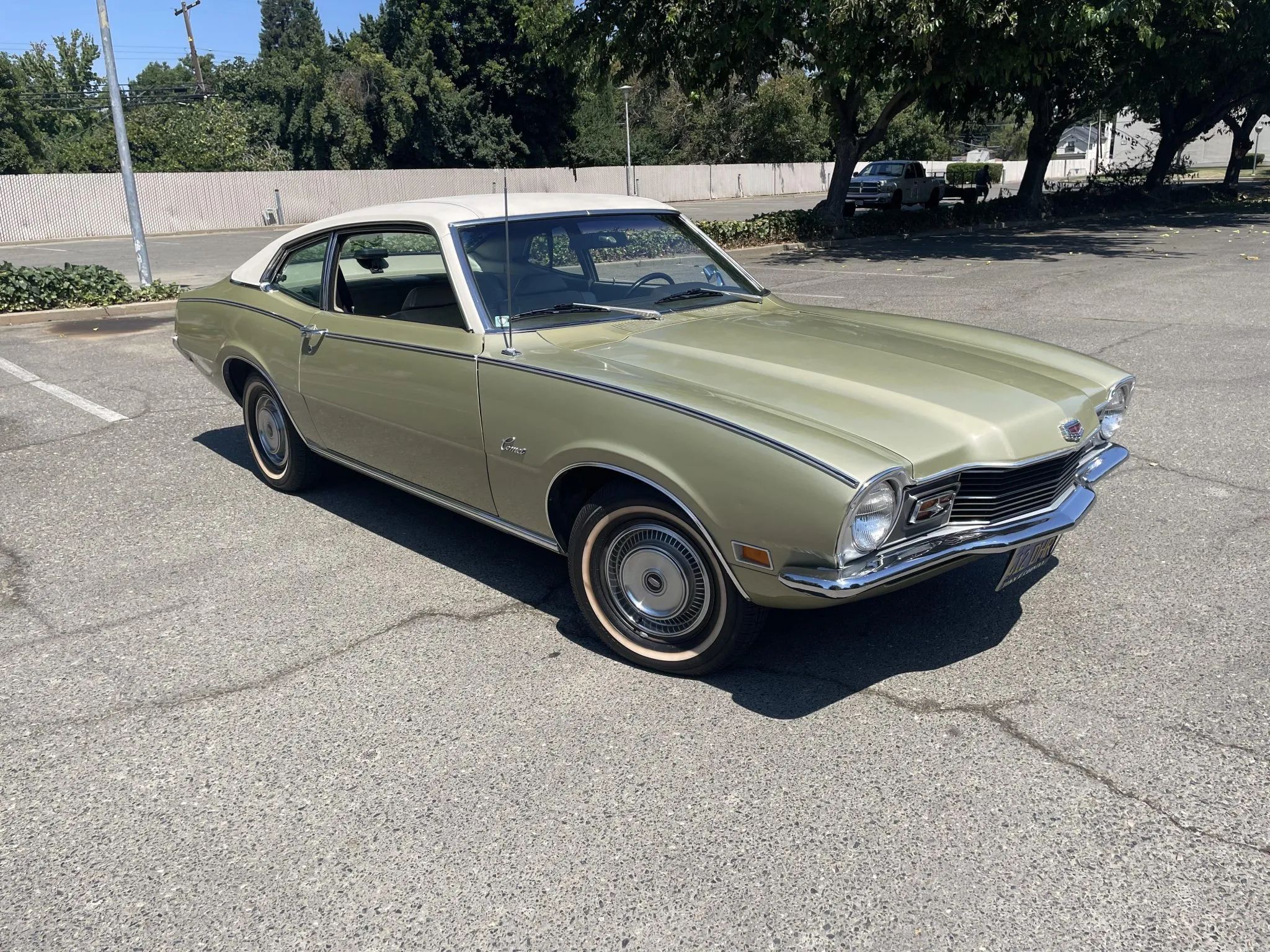 CC Tech: How the Mustang, Cougar, And Maverick Differed From The Original Ford Falcon Platform 37 Right front 3q view of a gold 1971 Mercury Comet two-door sedan with a white vinyl top