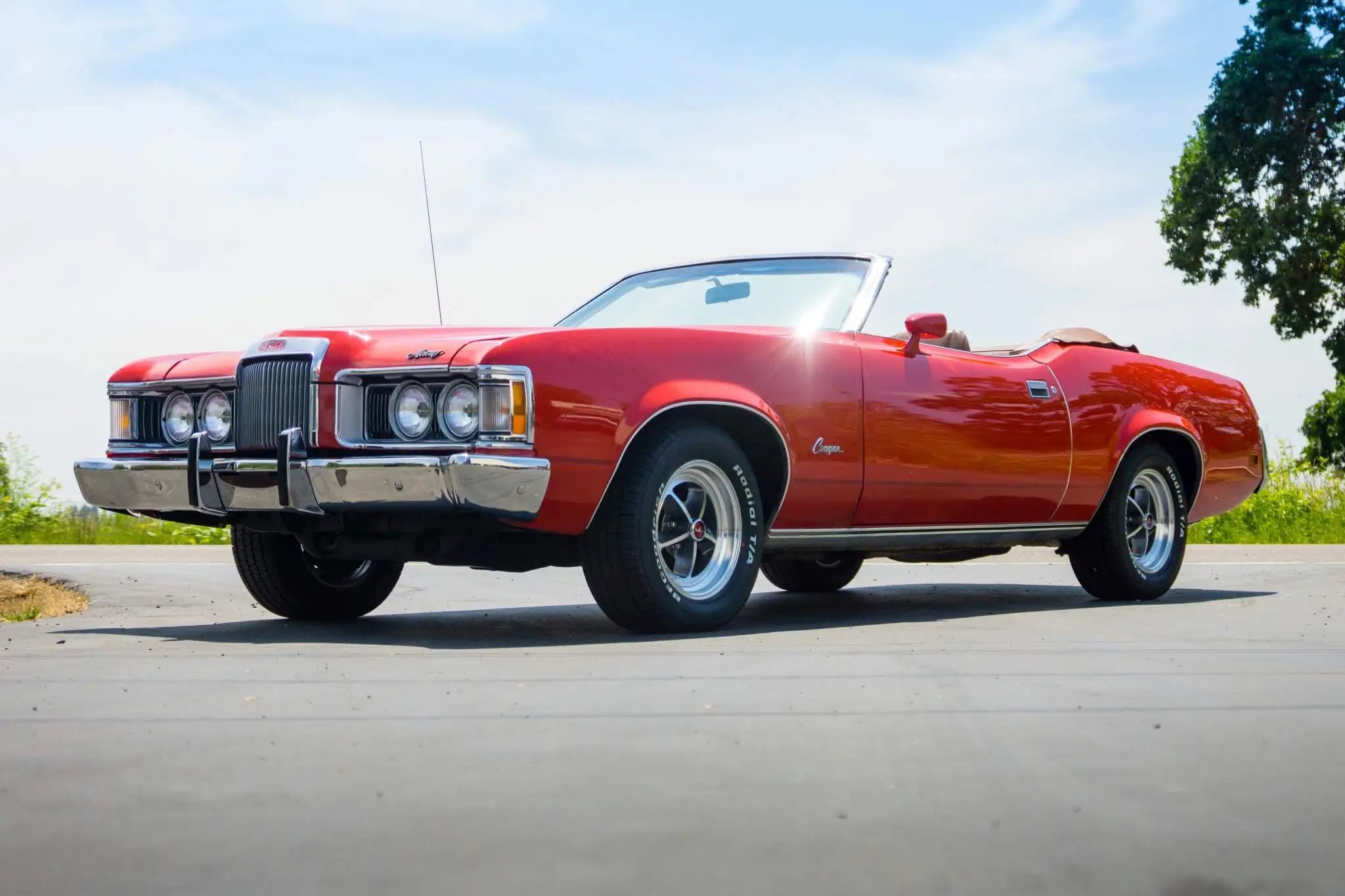 CC Tech: How the Mustang, Cougar, And Maverick Differed From The Original Ford Falcon Platform 29 Low-angle front 3q view of a Bright Red 1973 Mercury Cougar XR-7 convertible with the top down