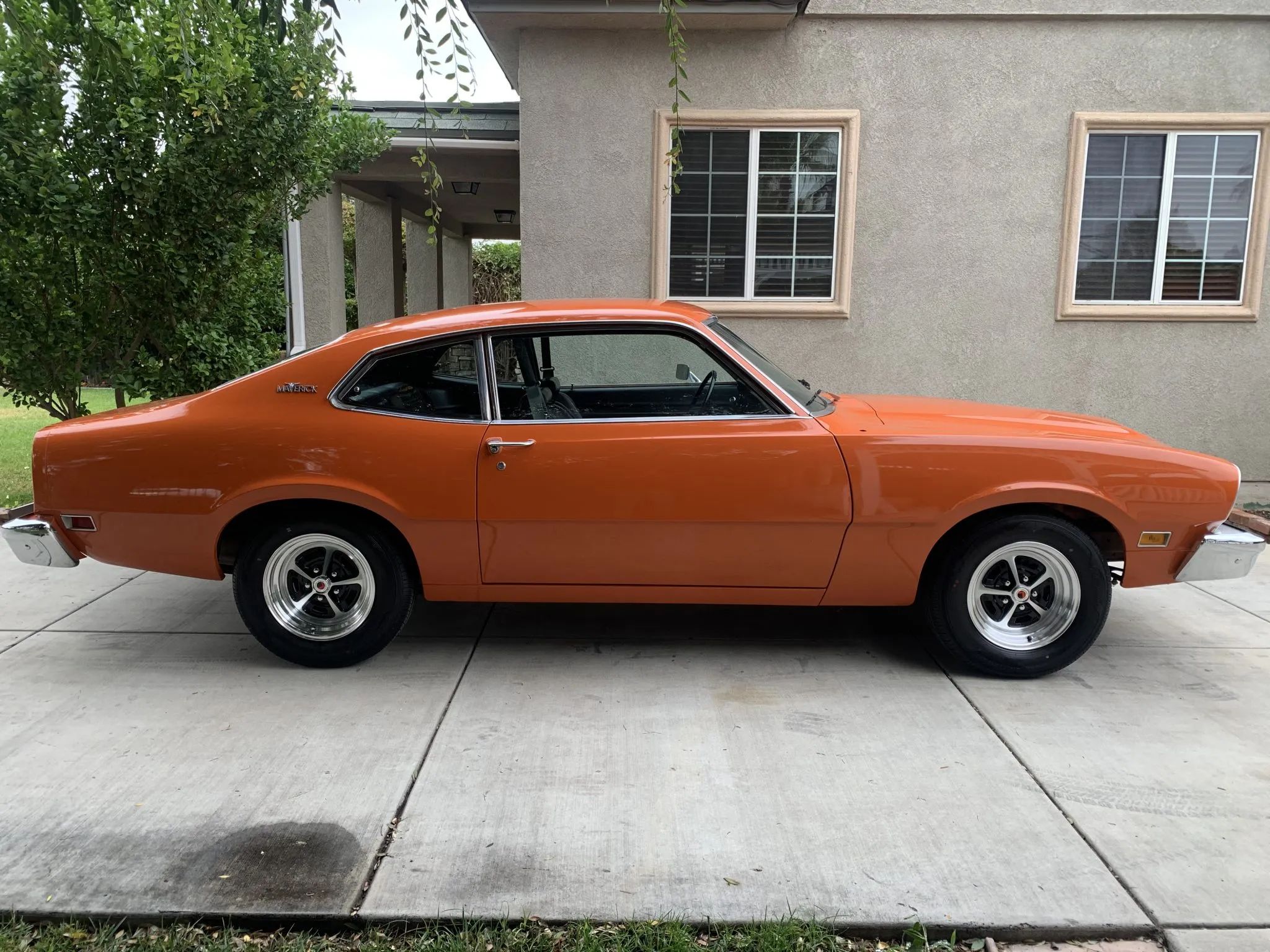 CC Tech: How the Mustang, Cougar, And Maverick Differed From The Original Ford Falcon Platform 36 Right side view of an orange 1974 Ford Maverick two-door sedan with styled wheels