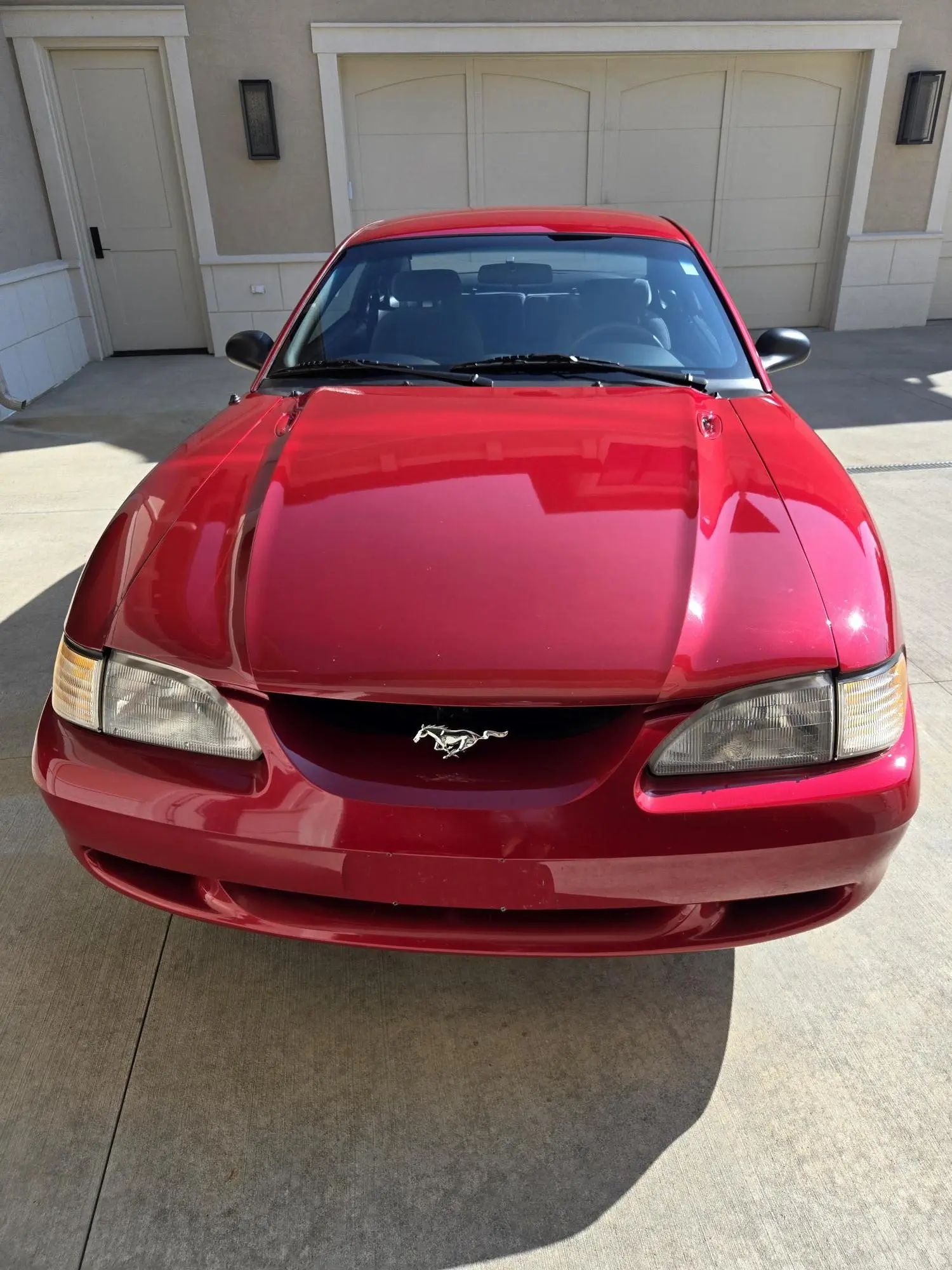 Rare 1995 Ford Mustang GTS Was A Short-Lived Reinvention Of The Old LX 5.0L 13 High-angle front view of a red 1995 Ford Mustang coupe