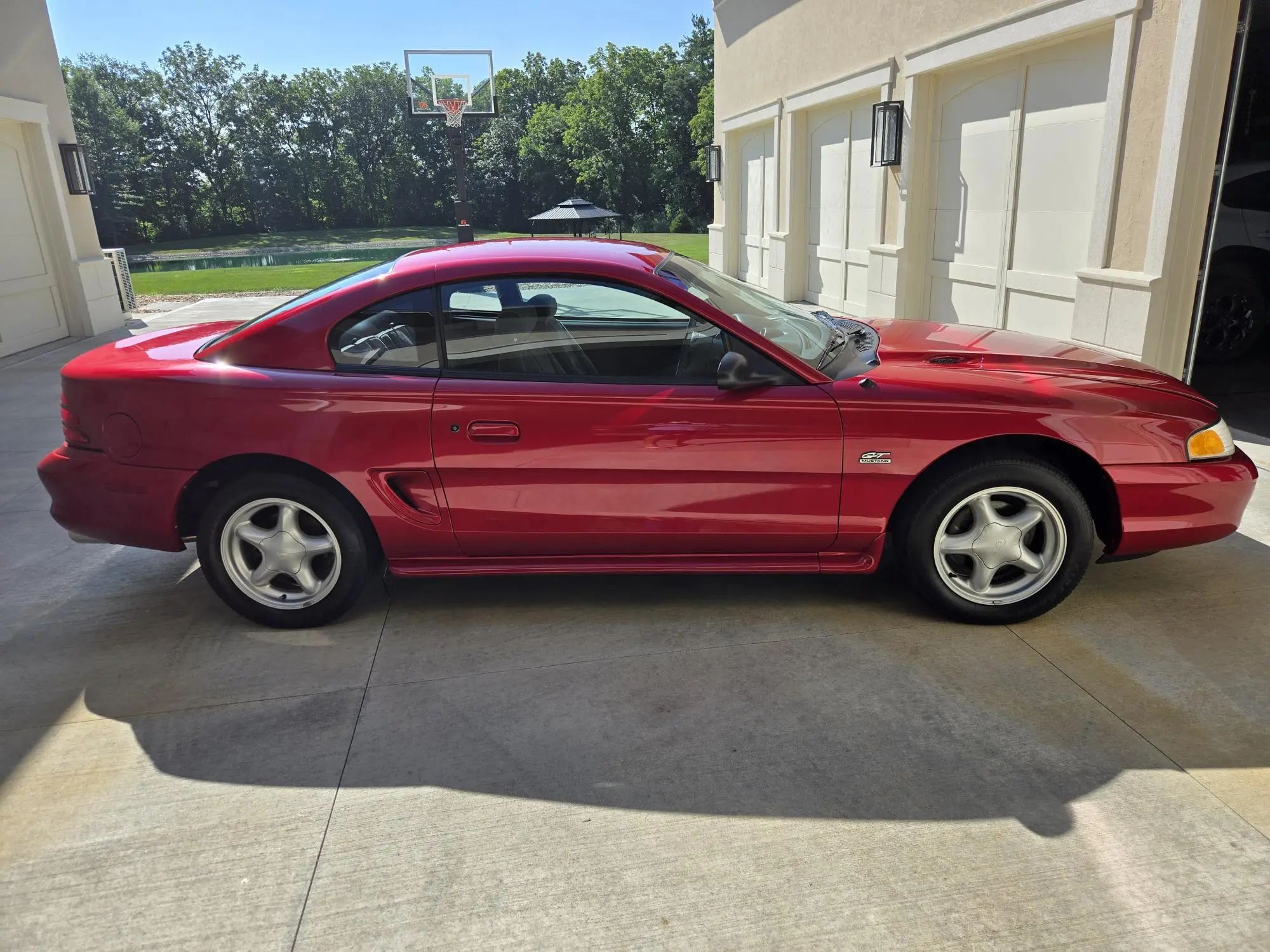 Rare 1995 Ford Mustang GTS Was A Short-Lived Reinvention Of The Old LX 5.0L 20 Right side view of a red 1995 Ford Mustang coupe
