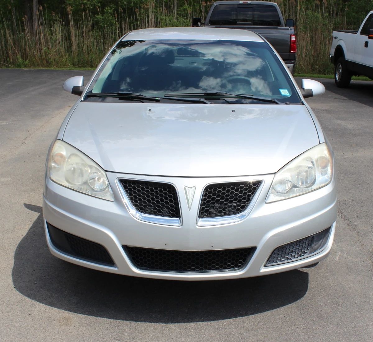 High-angle front view of a silver 2010 Pontiac G6 sedan