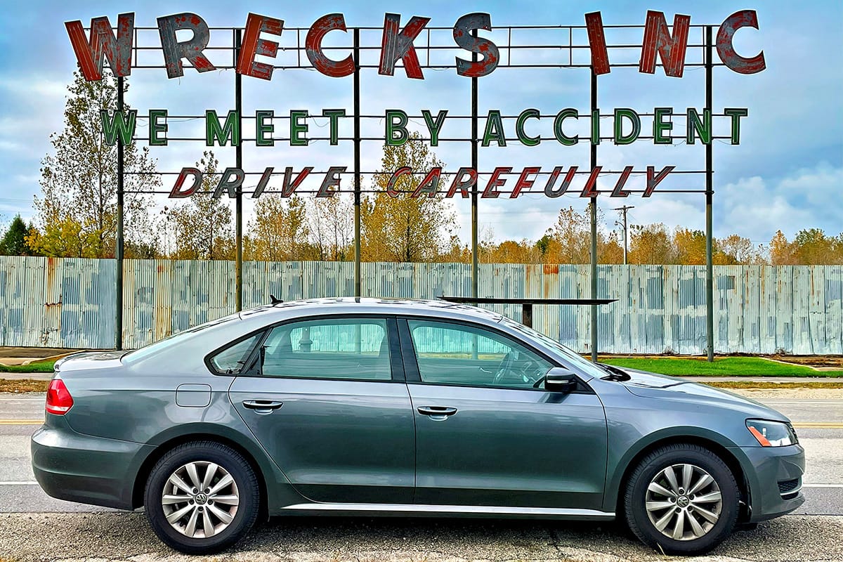 My 2013 Volkswagen Passat: A Dependable Car for Difficult Roads 1 Profile view of a 2013 Volkswagen Passat on the street