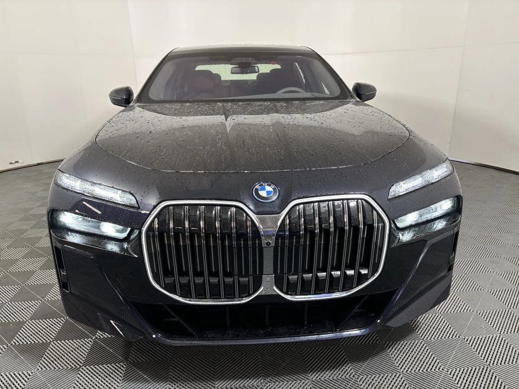 Front end of a black 2025 BMW 7-Series sedan with oversize twin kidney grilles