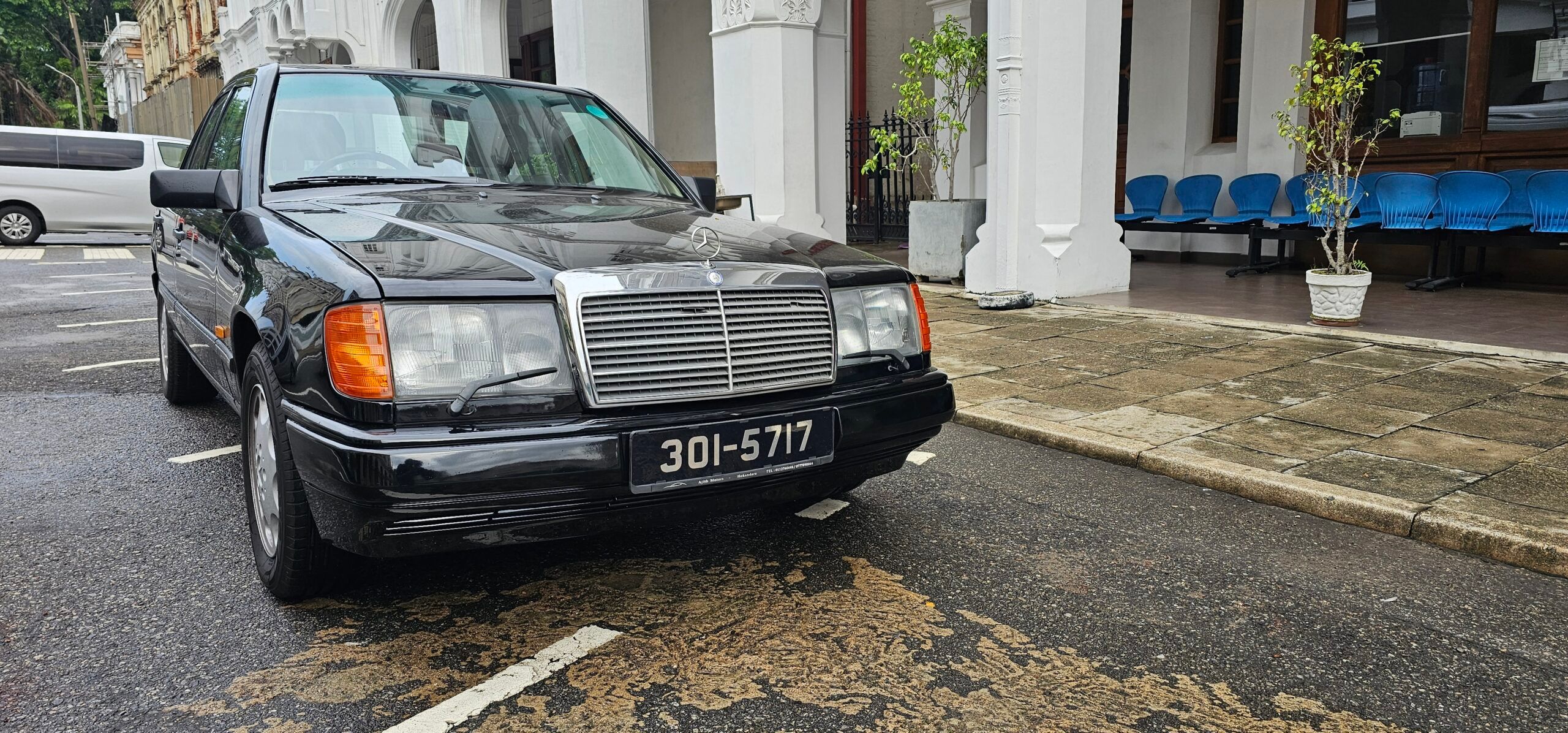 Photo of a black Mercedes-Benz W134 300E sedan
