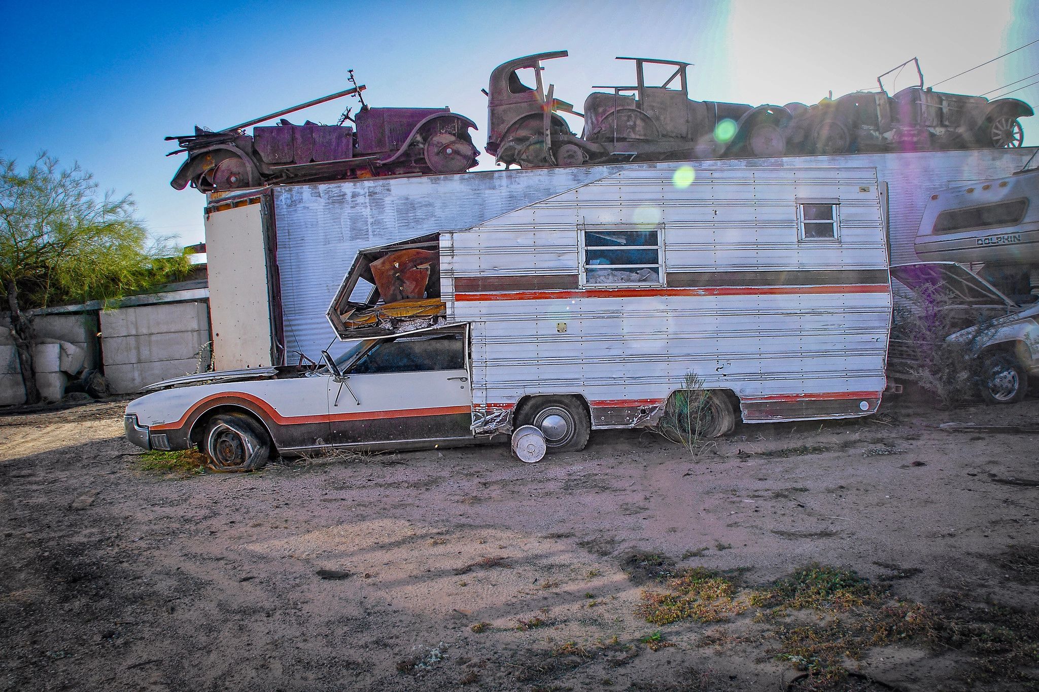 Junkyard Curiosity: 1967 Oldsmobile Toronado Camper Motorhome 1 An Oldsmobile Toronado converted to a camper motorhome, seen on its profile, sitting on a junkyard.