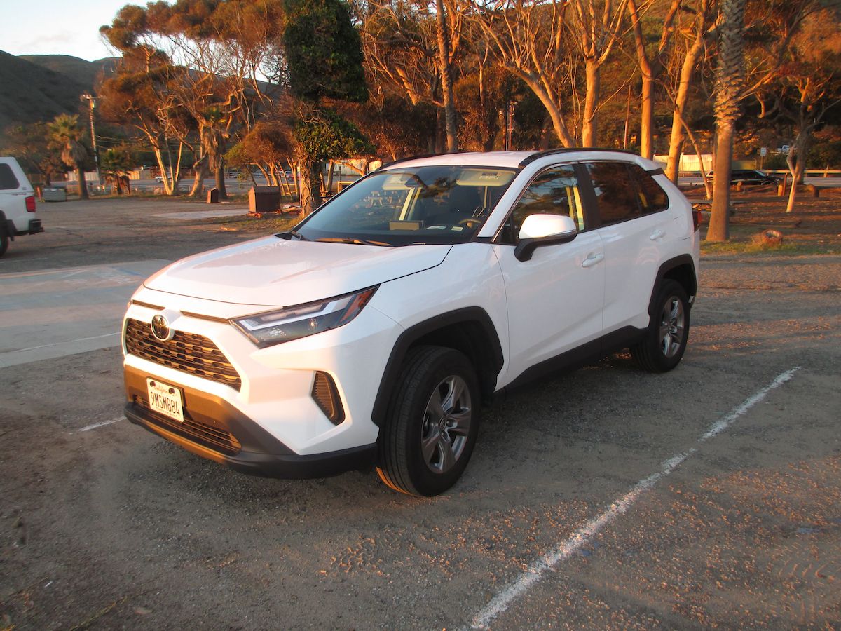 Rental Review: 2024 Toyota RAV4 – Responsible Adult Vehicle, 4 Wheels 1 Photo of a white 2024 Toyota RAV4 crossover in a parking lot
