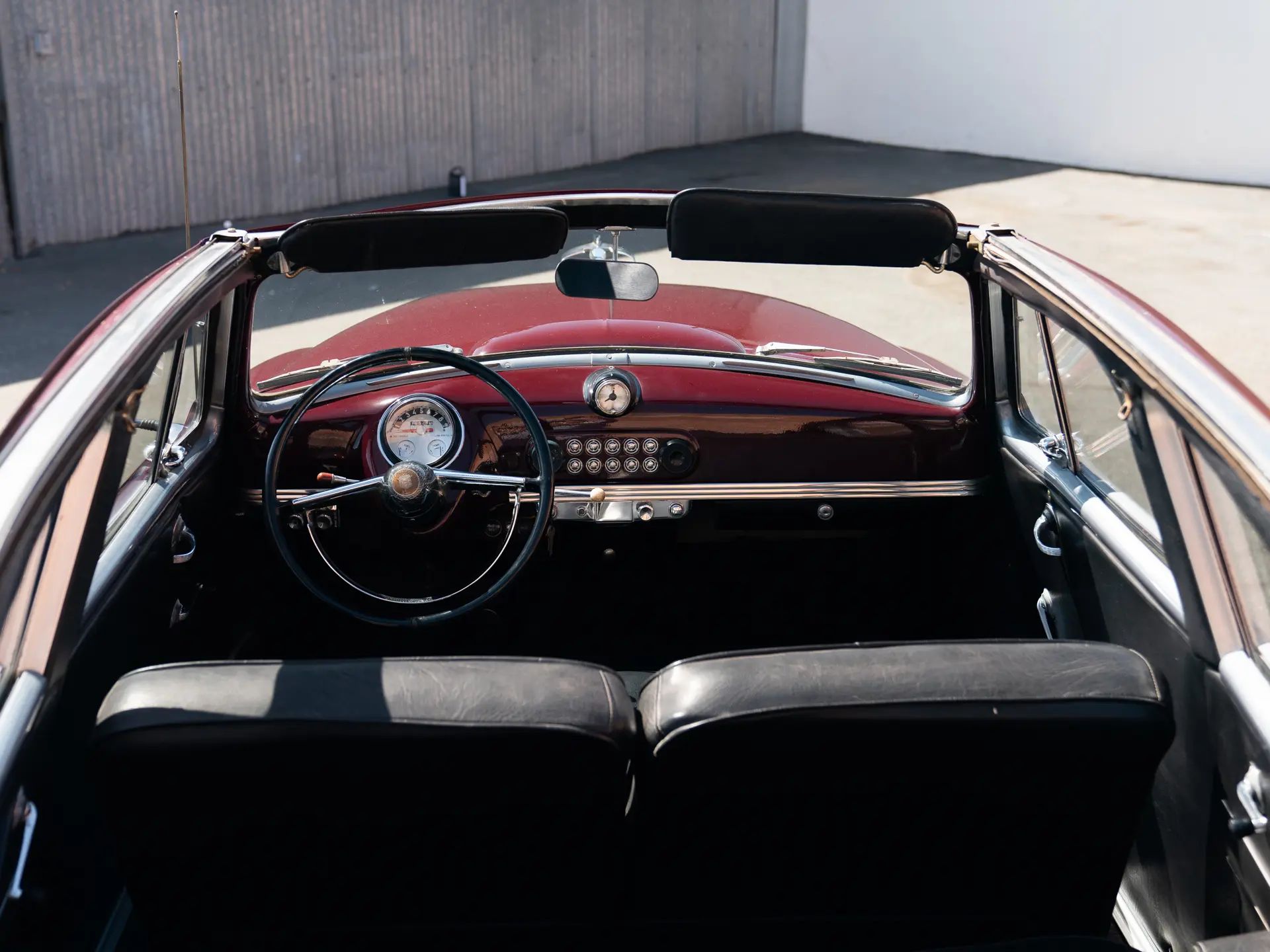 "Don't Try This With A Conventional Convertible" 3 Interior of a 1950 Nash Rambler Convertible Landau with its top down, showing the fixed side window frames