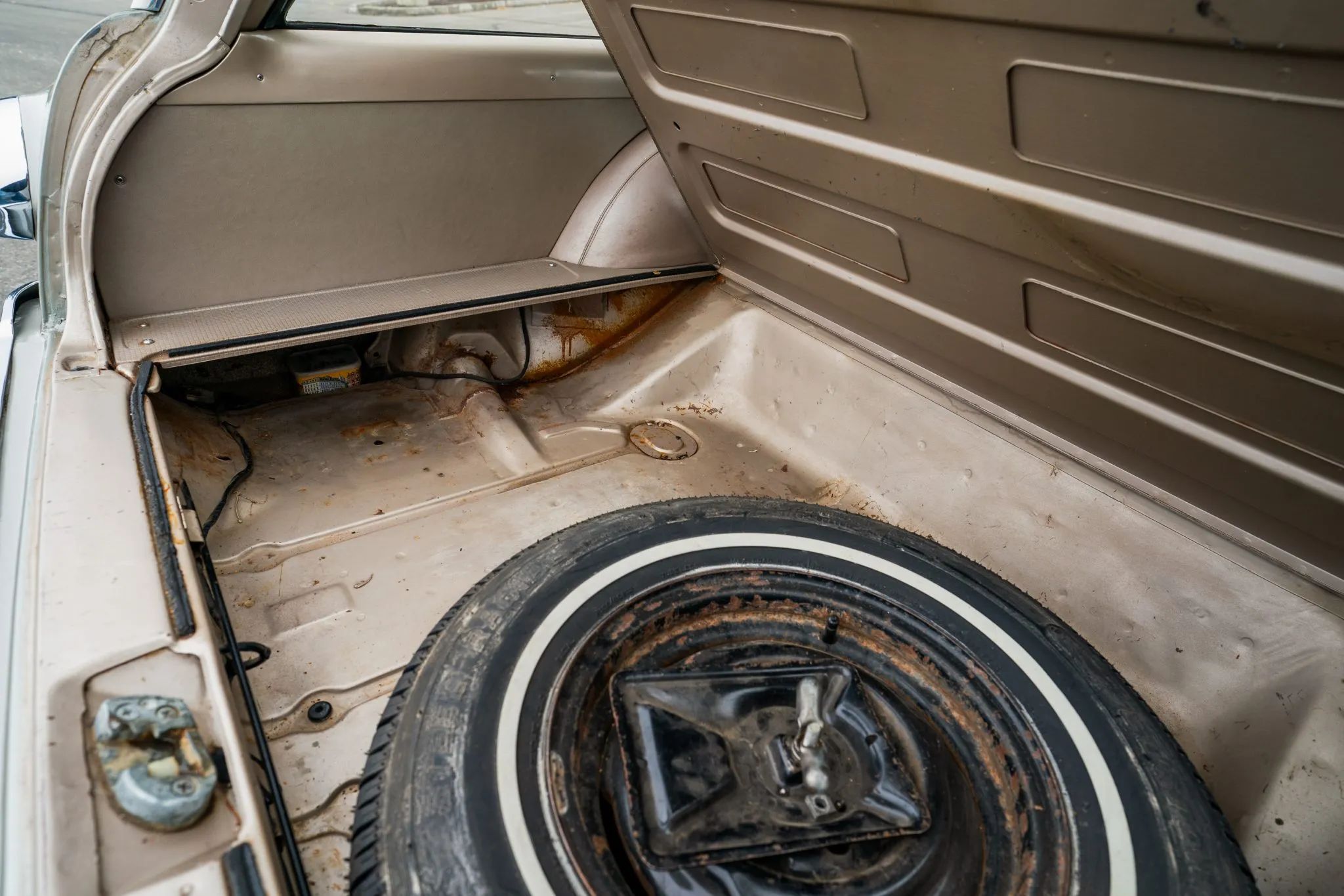 1961 Buick Special Wagon: Rare Three-Pedal Station Wagon With Aluminum V-8 And 3-Speed Stick 14 Under-floor compartment and spare tire of a 1961 Buick Special station wagon