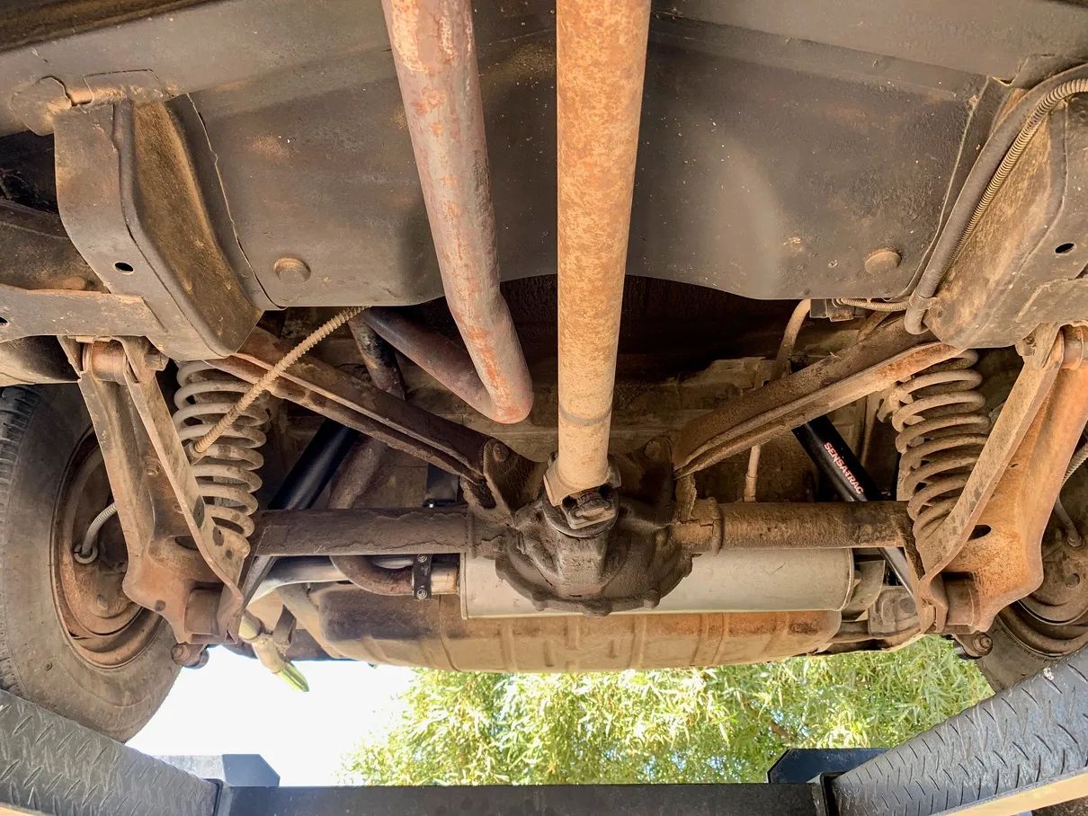 1961 Buick Special Wagon: Rare Three-Pedal Station Wagon With Aluminum V-8 And 3-Speed Stick 15 Rear suspension of a 1961 Buick Special, seen from below with the car on a hoist