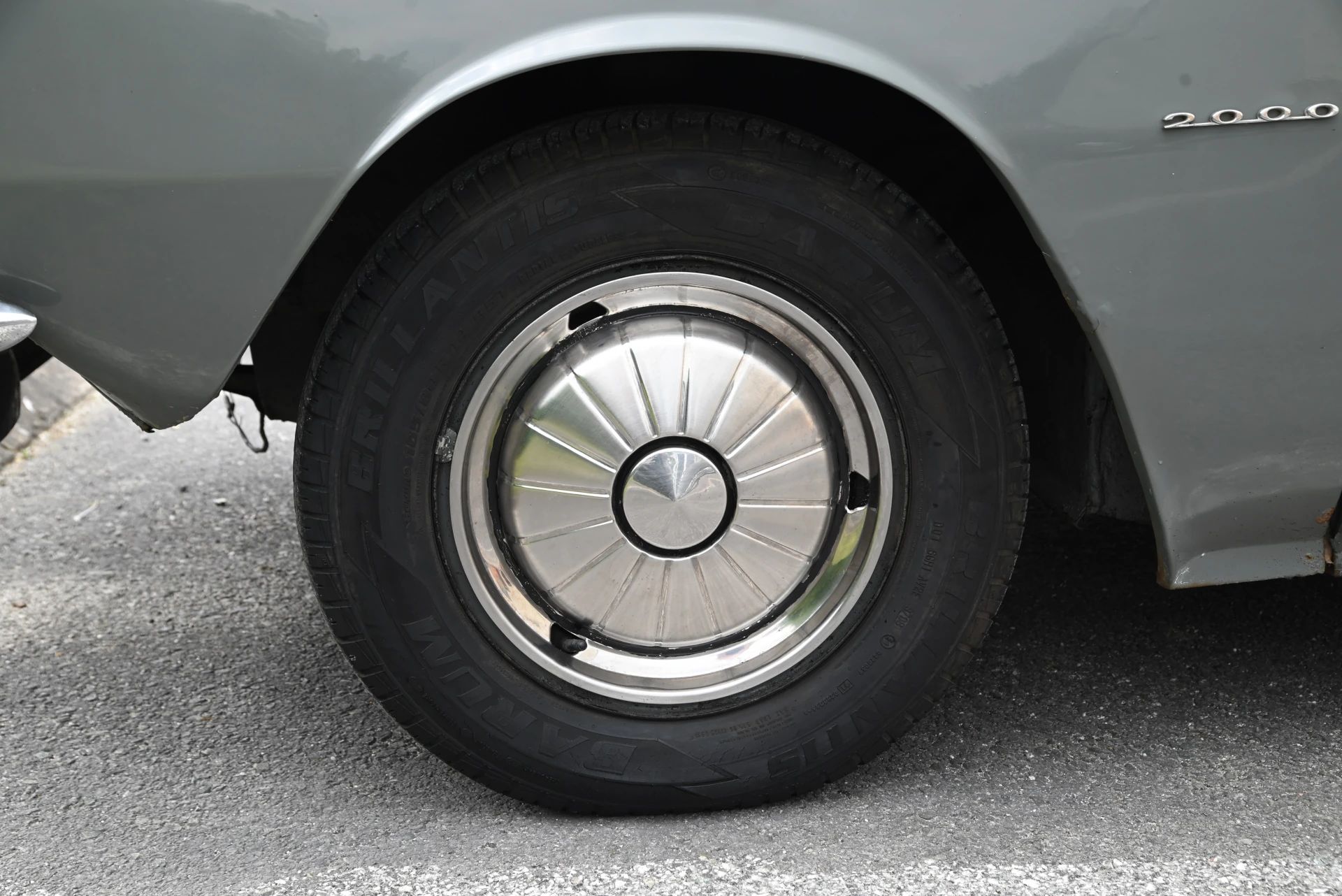 Wheel and tire of a City Grey 1966 Rover 2000 (P6)