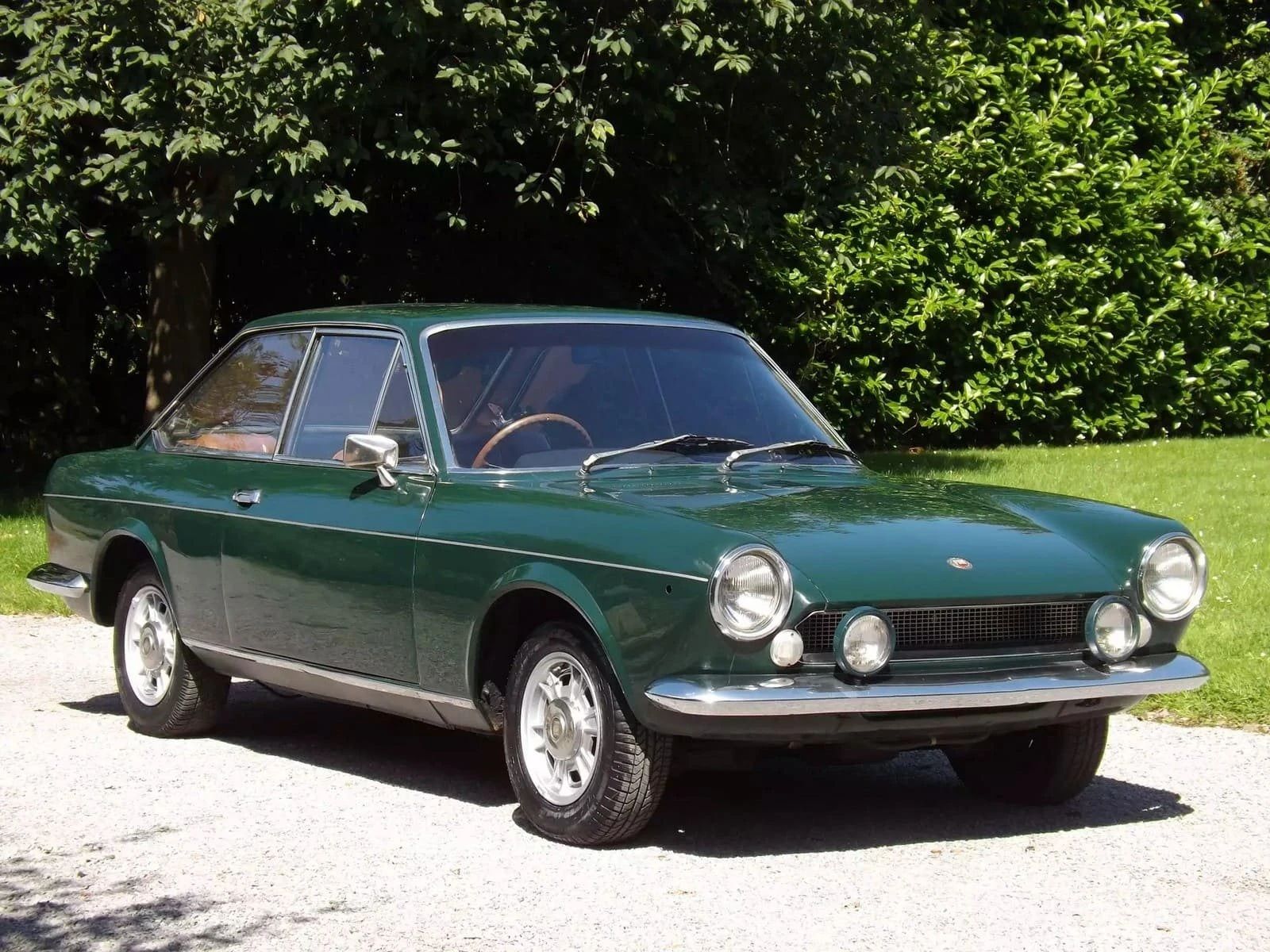 Right front 3q view of a dark green 1968 Fiat 124 coupe