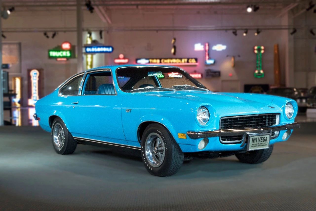 Right front 3q view of a blue 1971 Chevrolet Vega three-door coupe in an indoor museum space