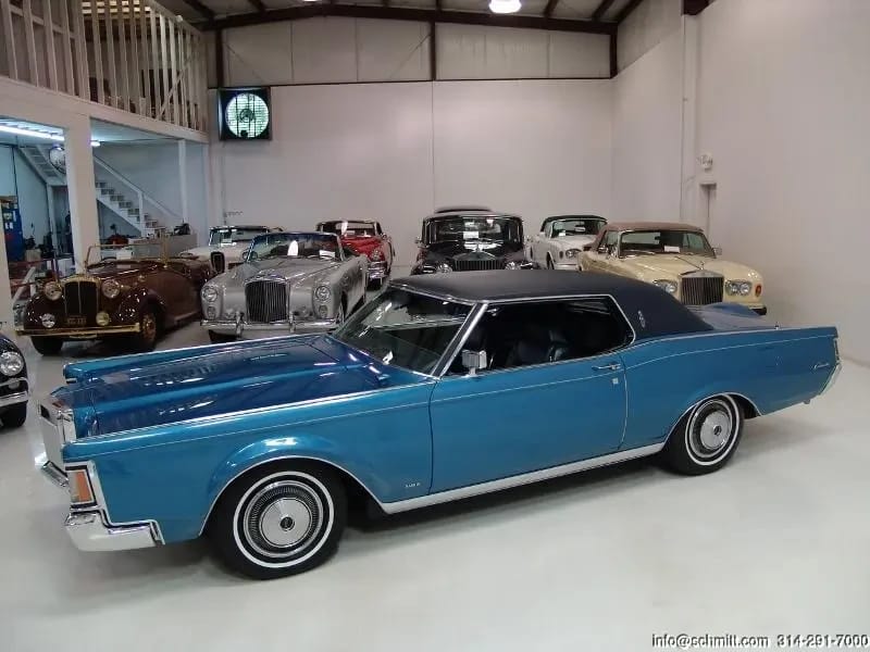 High-angle left side view of a blue 1971 Lincoln Mark III