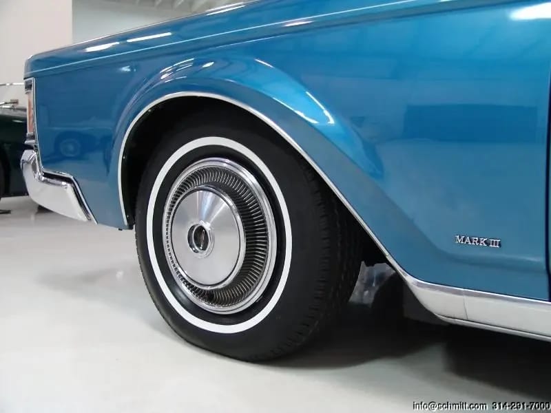 Left front fender of a blue 1971 Lincoln Mark III