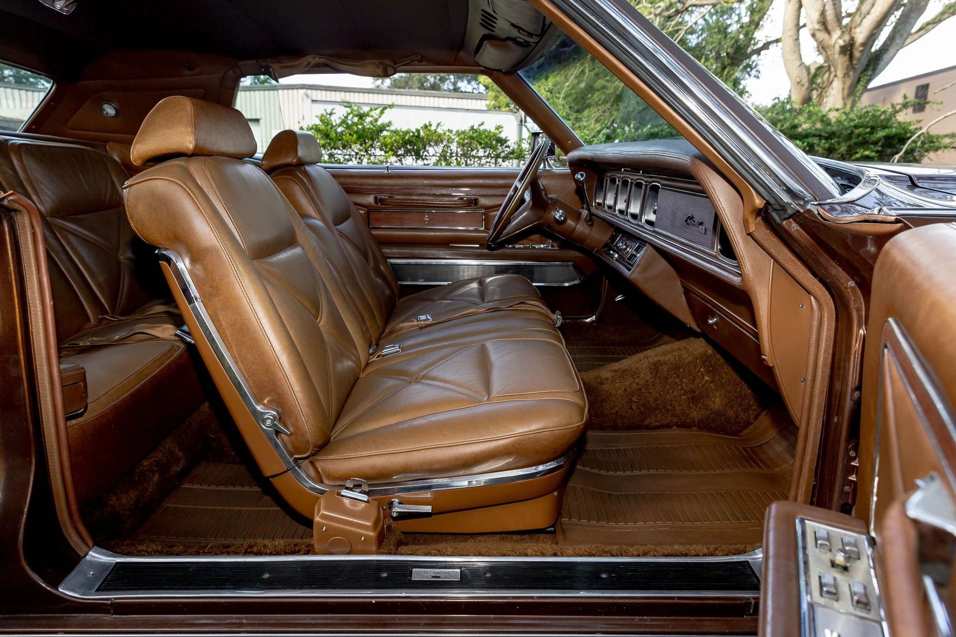 Front seat of a 1971 Lincoln Mark III with brown interior