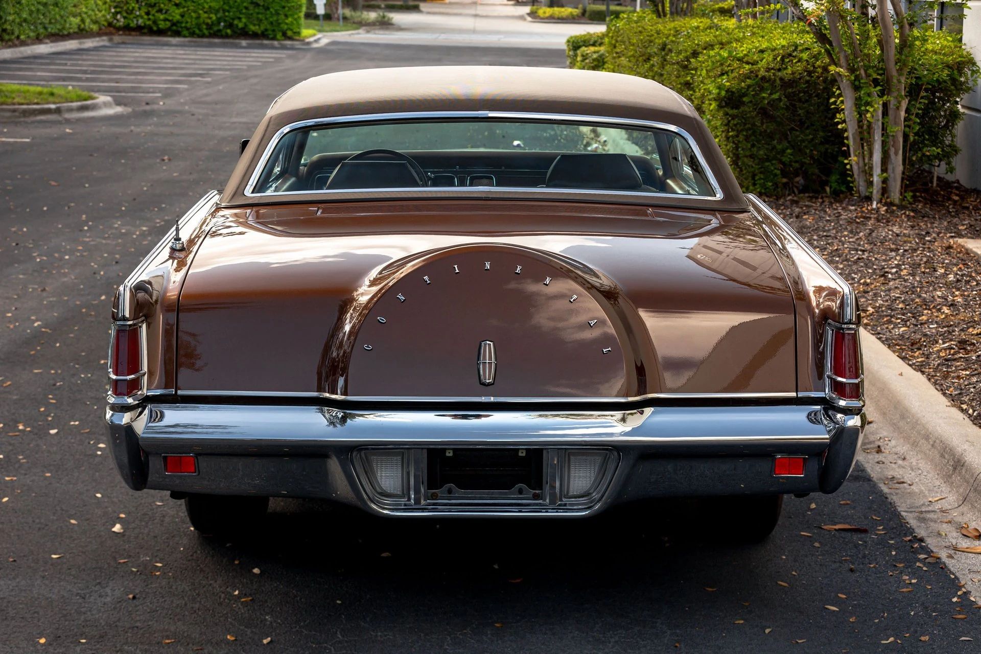 Rear view of a bronze 1971 Lincoln Mark III