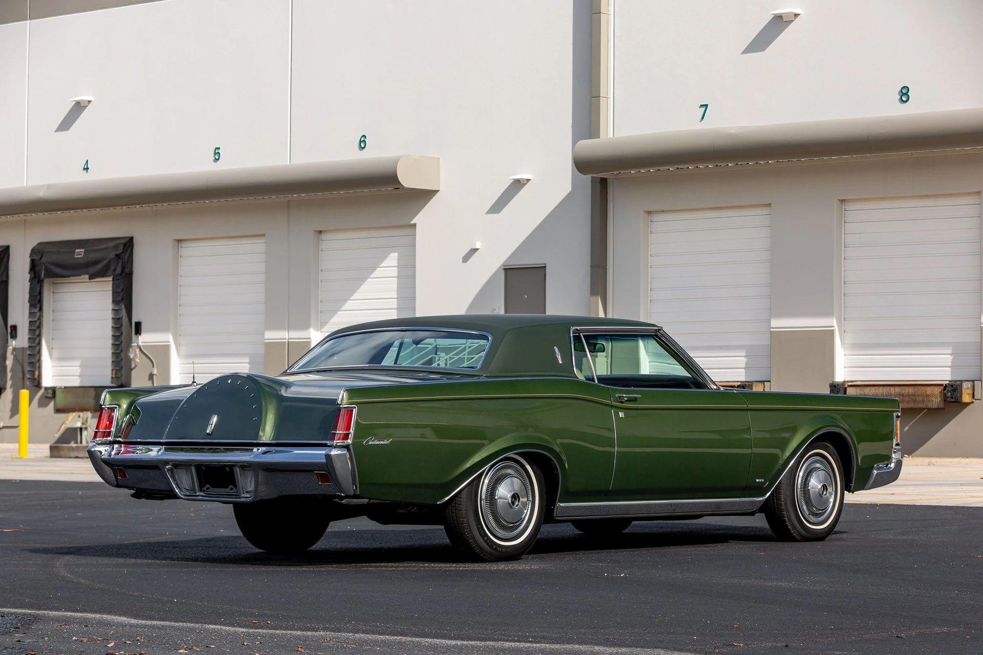 Right rear 3q view of a metallic green 1971 Mark III
