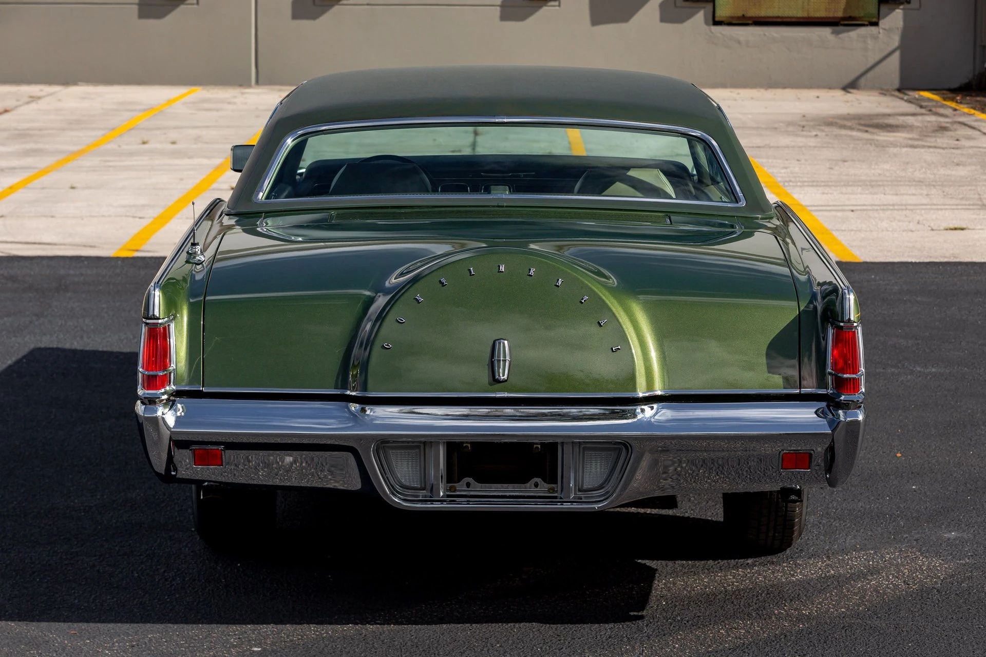 Rear view of a metallic green 1971 Mark III