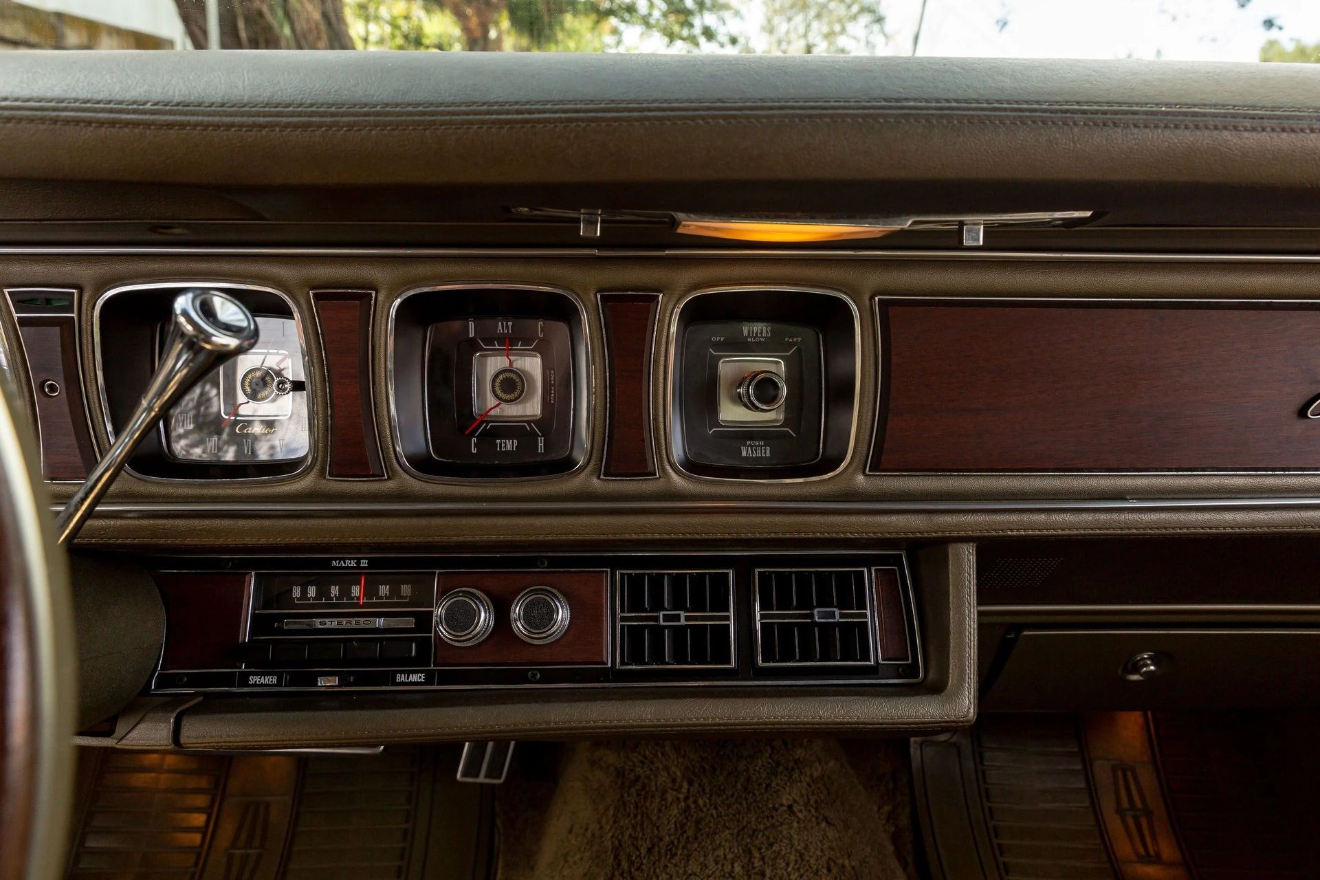 Radio, gauges, and wiper controls in the dash of a 1971 Lincoln Mark III