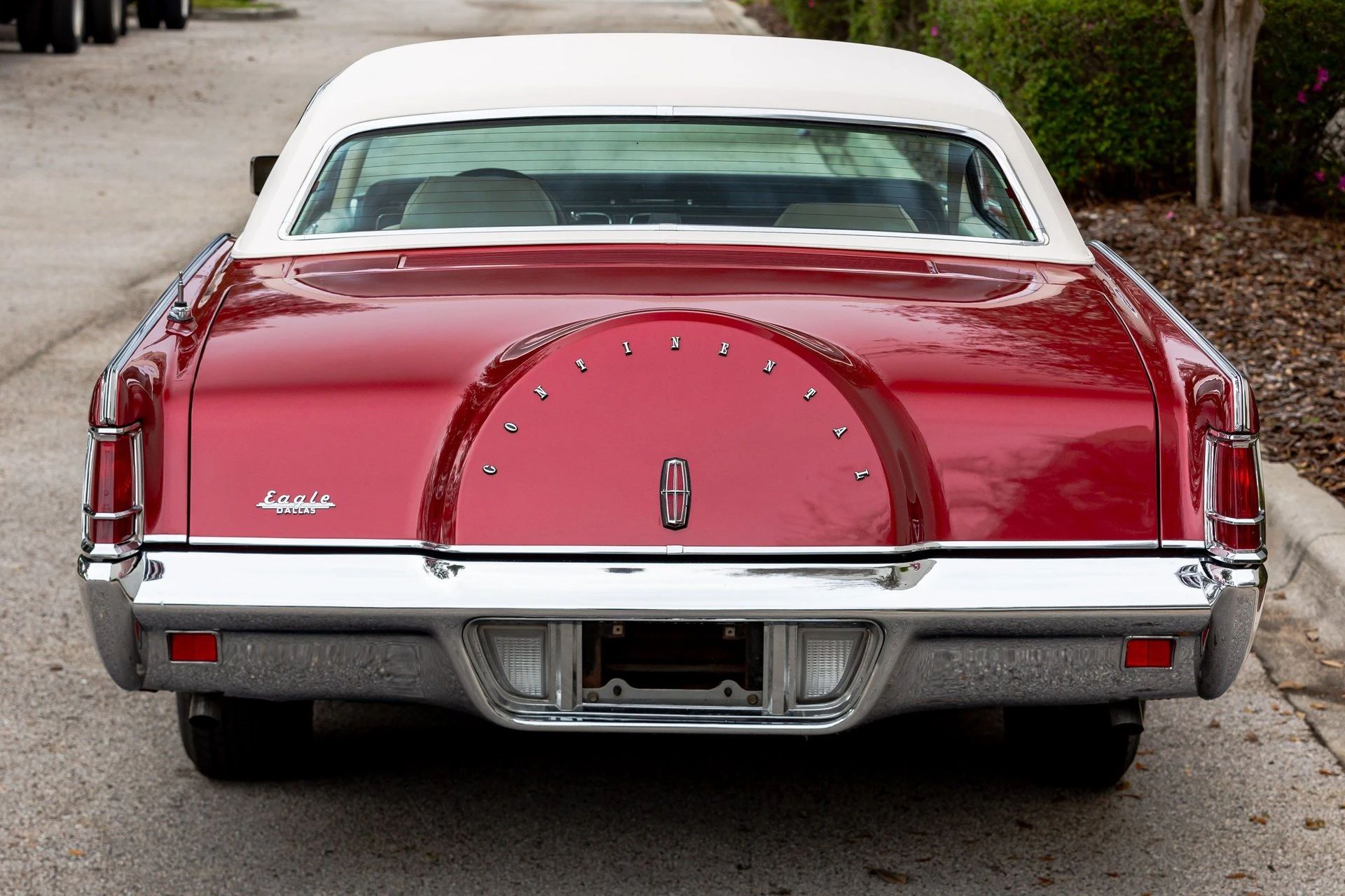 Rear view of a metallic red 1971 Lincoln Mark III