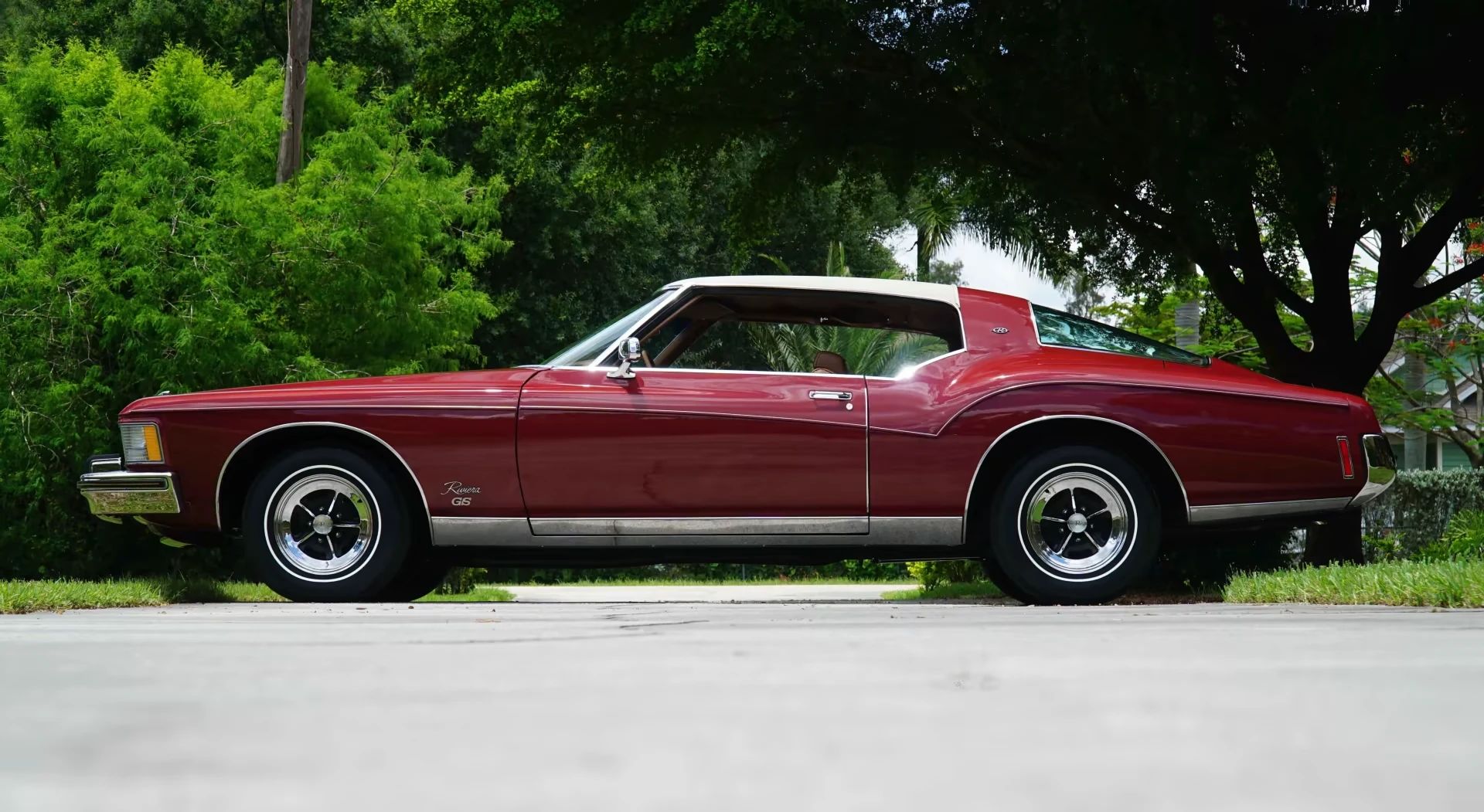 1973 Buick Riviera GS Stage 1 With Rare MaxTrac Traction Control: No Fishtailing In Your Boattail 16 Left side view of a red 1973 Buick Riviera
