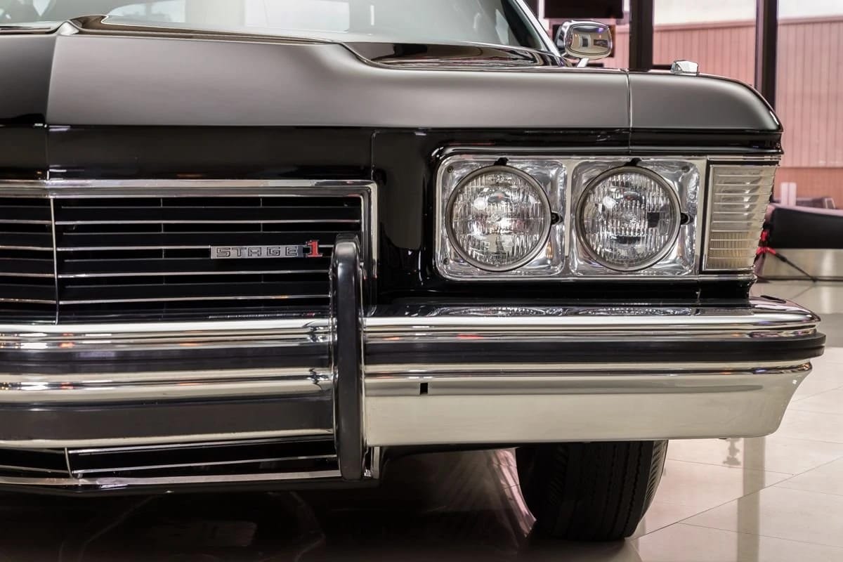 1973 Buick Riviera GS Stage 1 With Rare MaxTrac Traction Control: No Fishtailing In Your Boattail 9 Grille and front headlights of a black 1973 Buick Riviera with a "Stage 1" grille badge