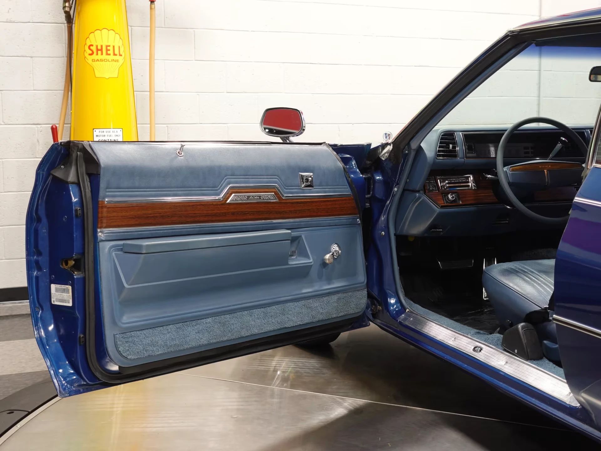 1976 Buick LeSabre V-6: Why Did Buick Build This Rare, Slow, Massively Underpowered Big Car? 11 Driver's door trim of a blue 1976 Buick LeSabre