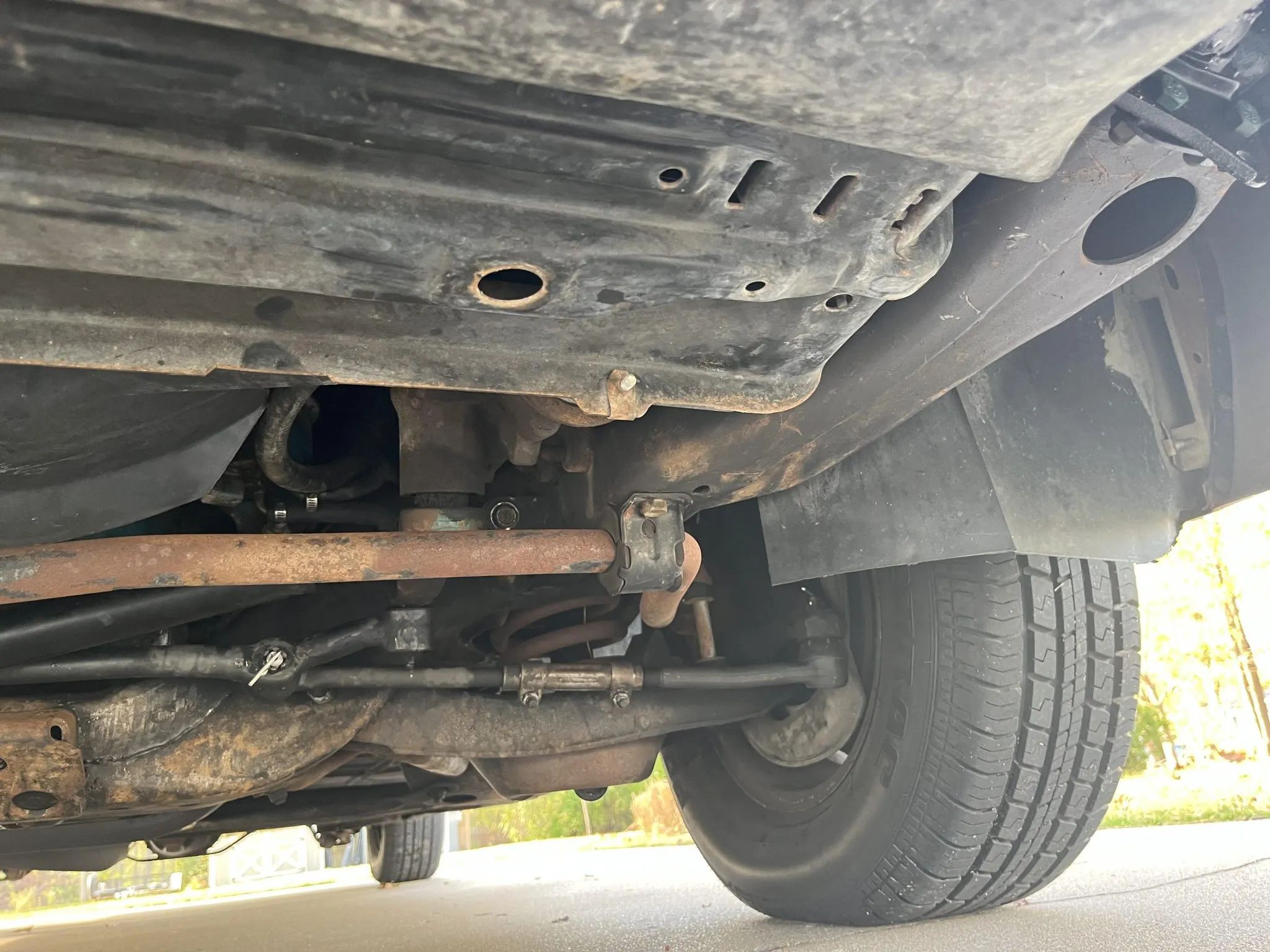 Left front suspension of a 1977 Cadillac, seen from the front of the car