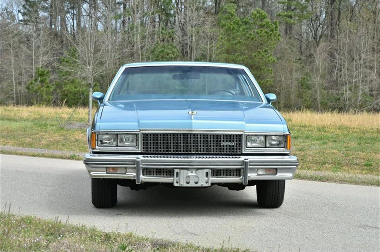 Front view of a two-tone blue 1977 Chevrolet Caprice coupe