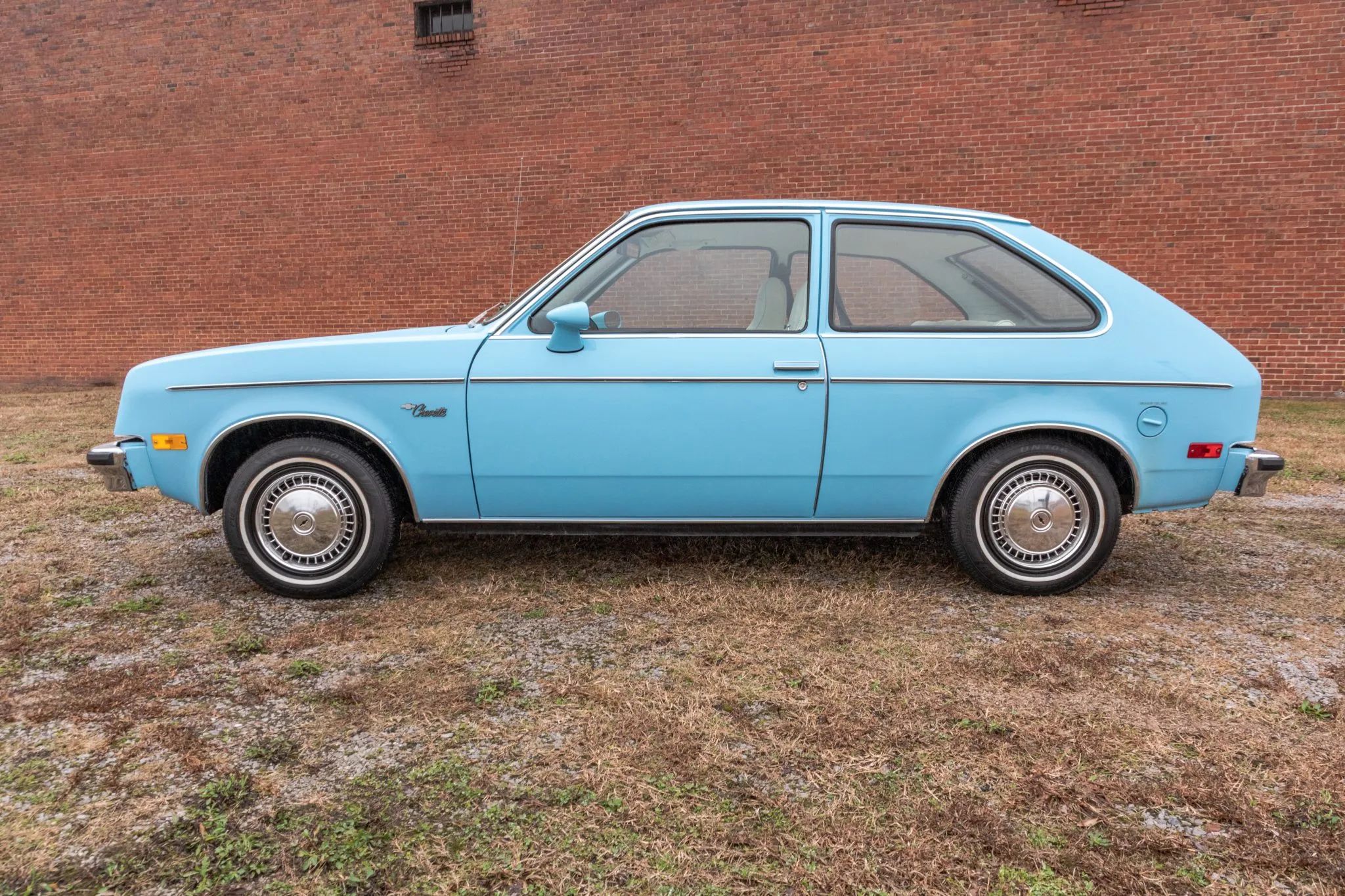 Left side of a blue 1977 Chevrolet Chevette hatchback
