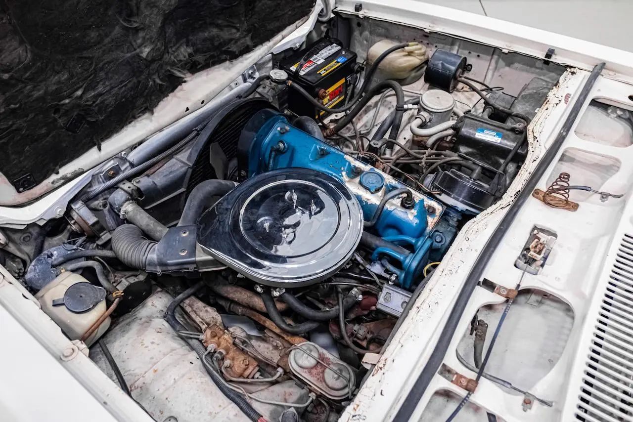 Engine in a white 1977 Chevrolet Vega